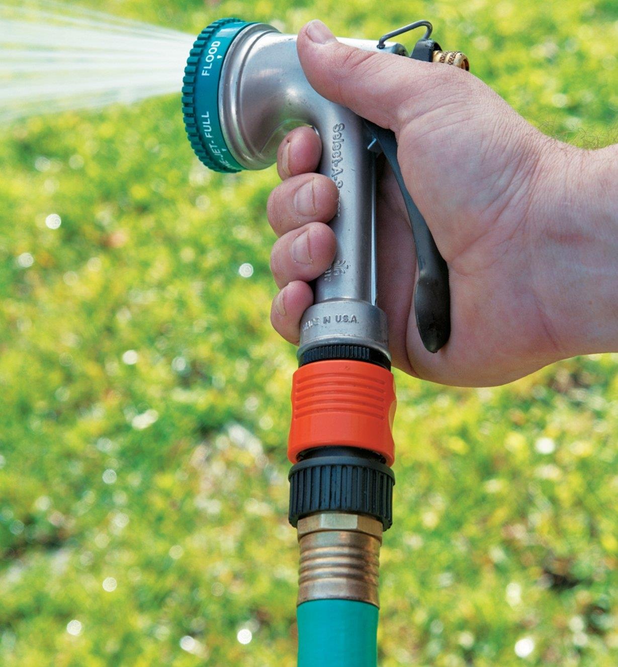 Male and female quick-connects attaching a hose to a sprayer