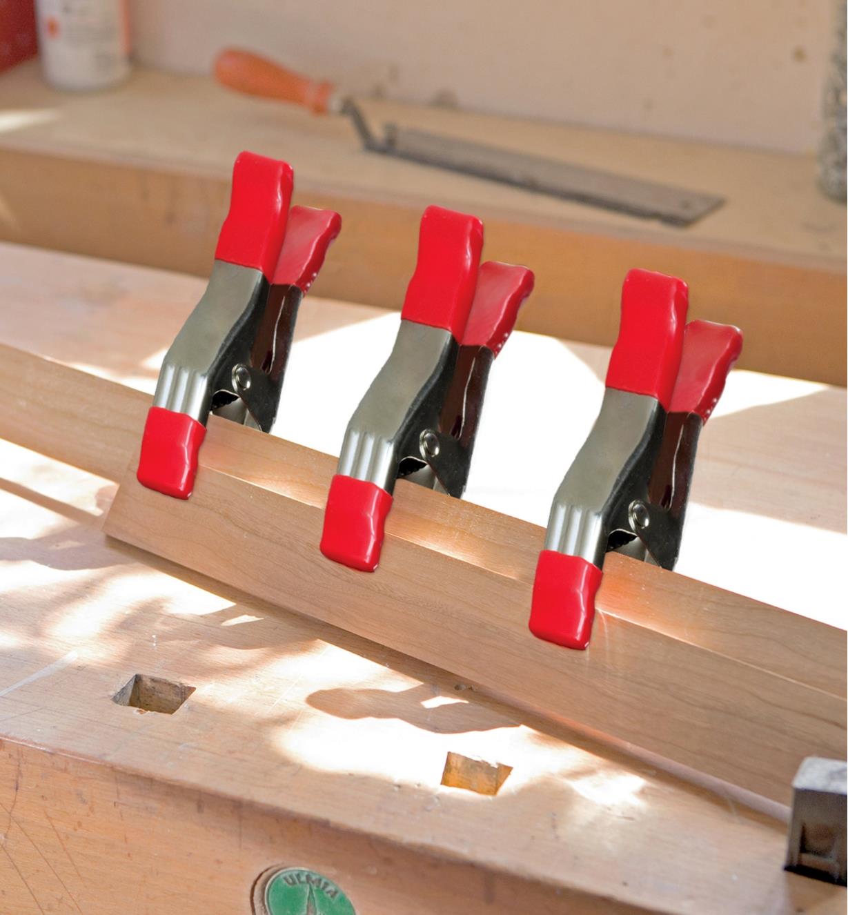 Bessey steel spring clamps holding a wooden assembly in position while the glue sets