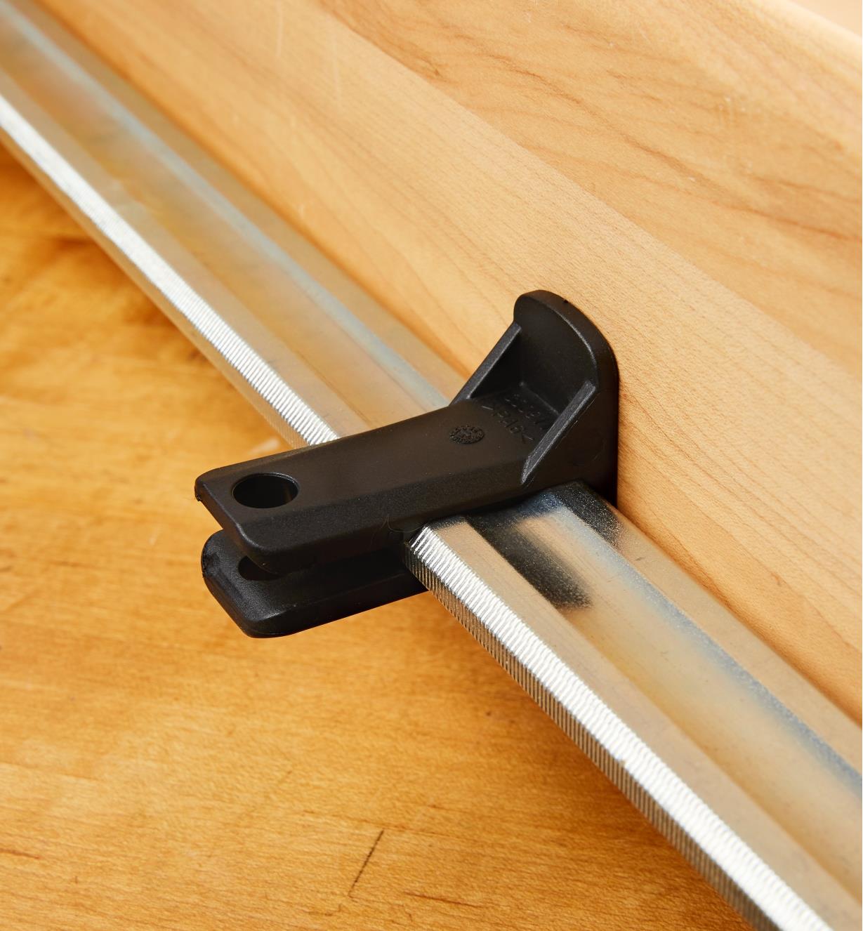 A Bessey K-Body rail protector mounted on a K-Body clamp rail