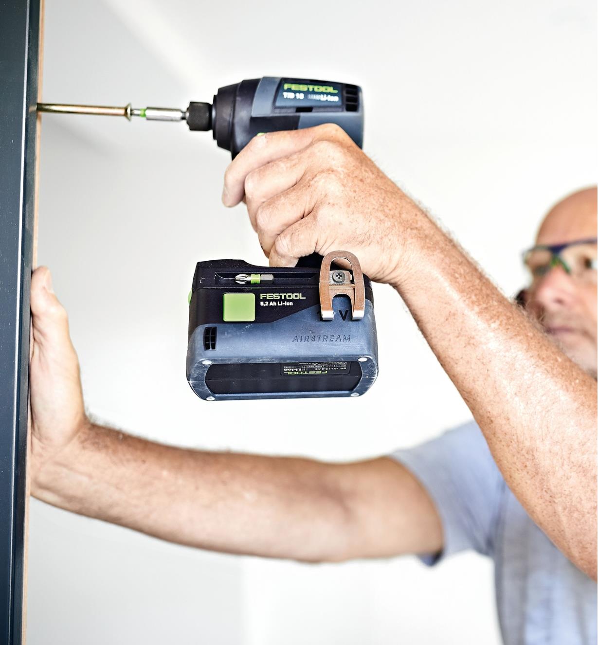 Driving a screw into a metal bracket with the Festool TID 18 Cordless Impact Screwdriver