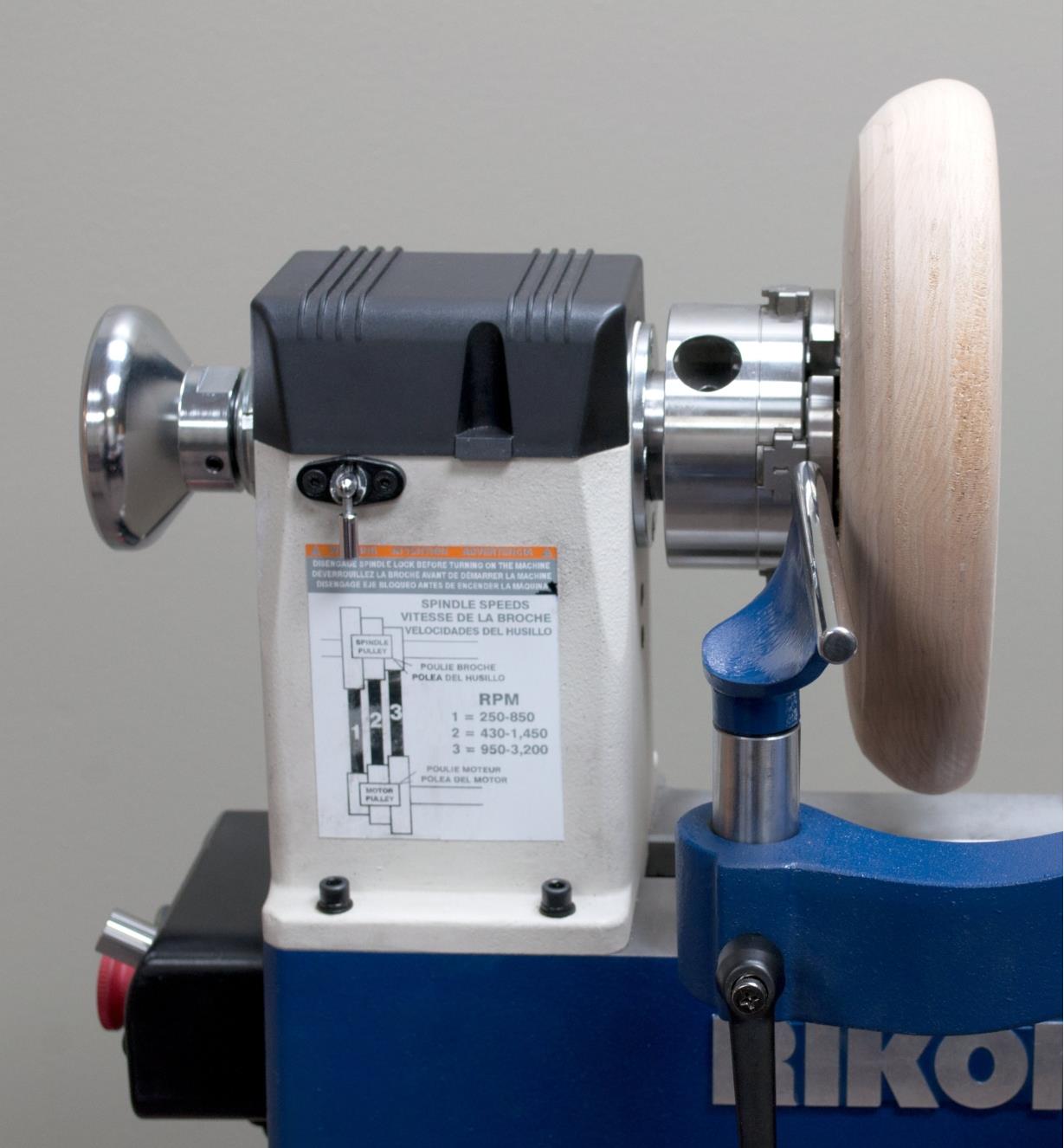 The optional tool rest extension shown mounted on the banjo of a Rikon 70-150VSR Midi lathe