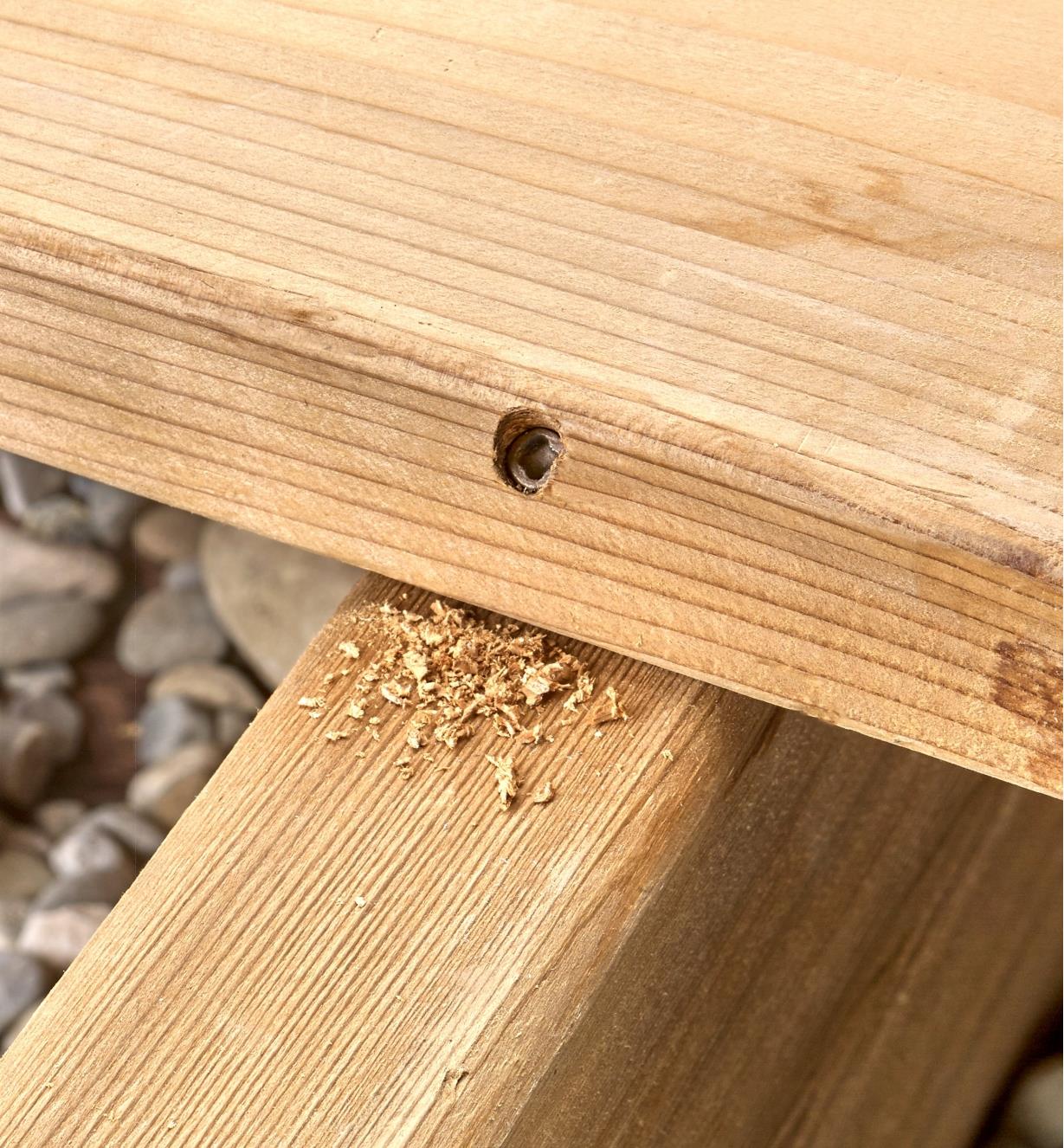 Close up of deck board showing how screw is concealed in the side