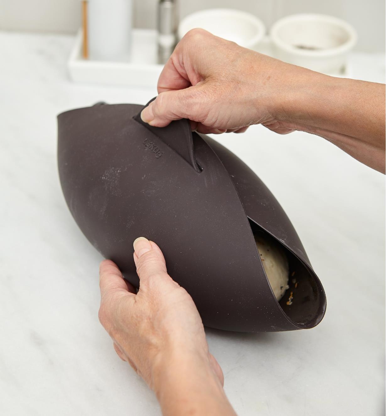 Silicone bowl closed around dough, ready for baking