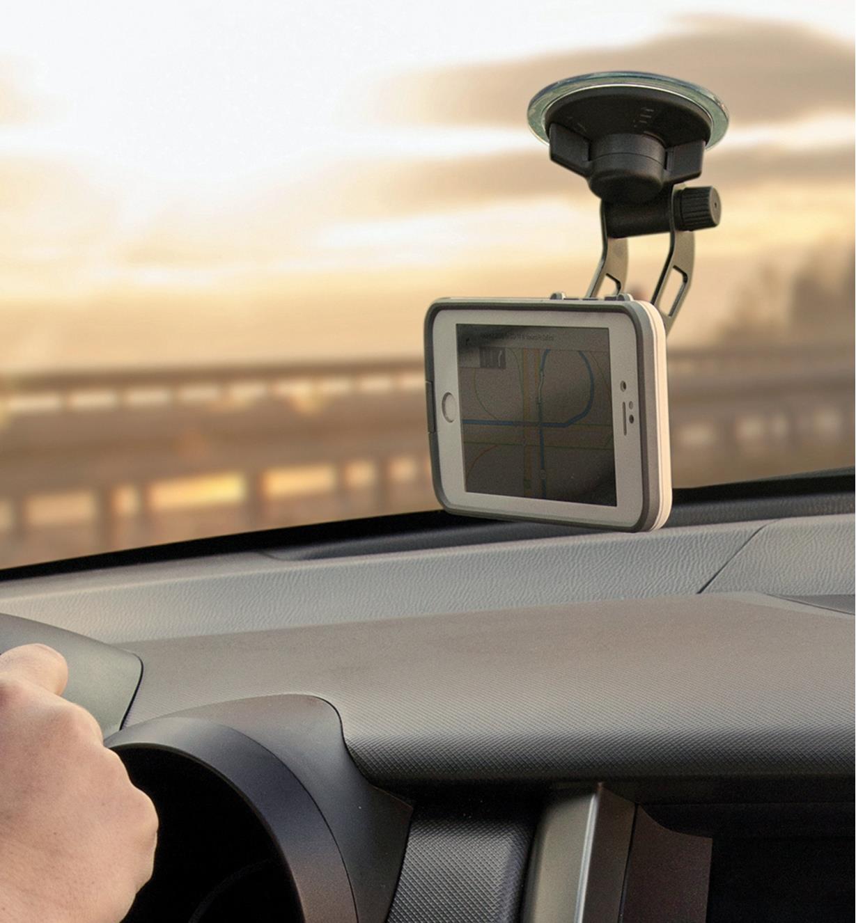 Windshield-Mount Kit installed on a car windshield with a cell phone attached