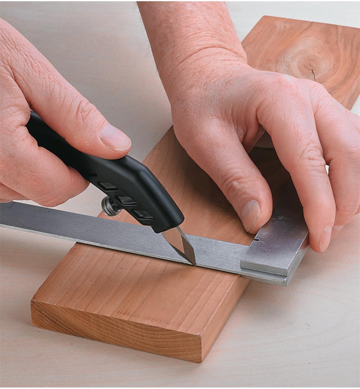 Marking a board with a shop knife using a pistol grip