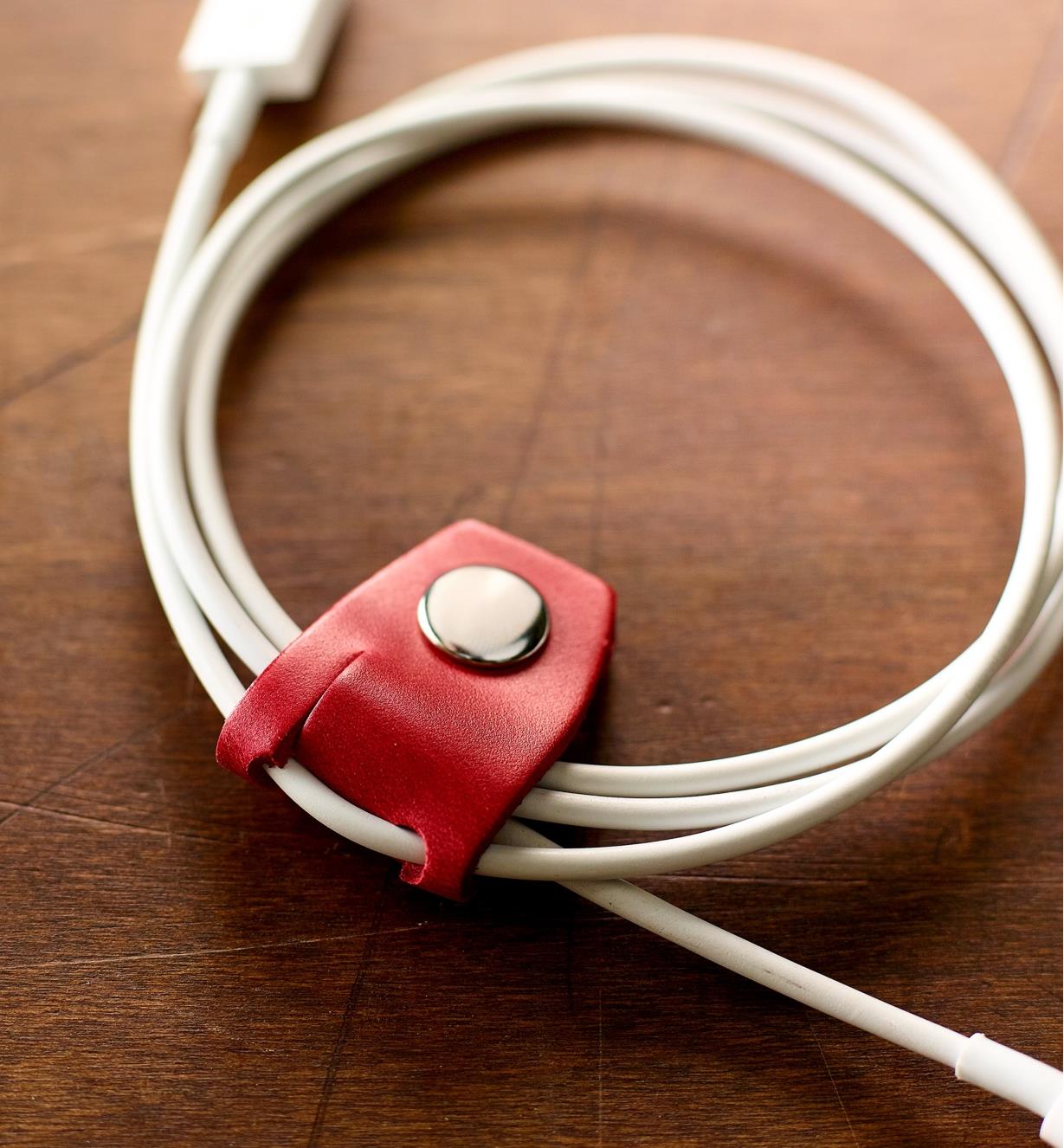 Close-up of Leather Cord Keeper holding a bundled cord