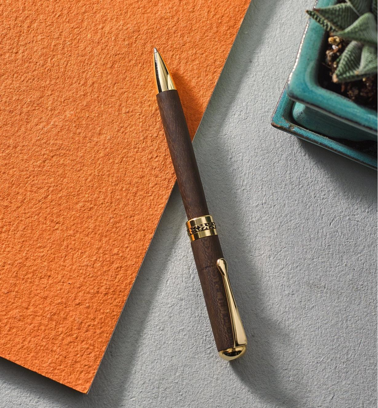 Example of a New Series gold pen turned from a wood blank. 
