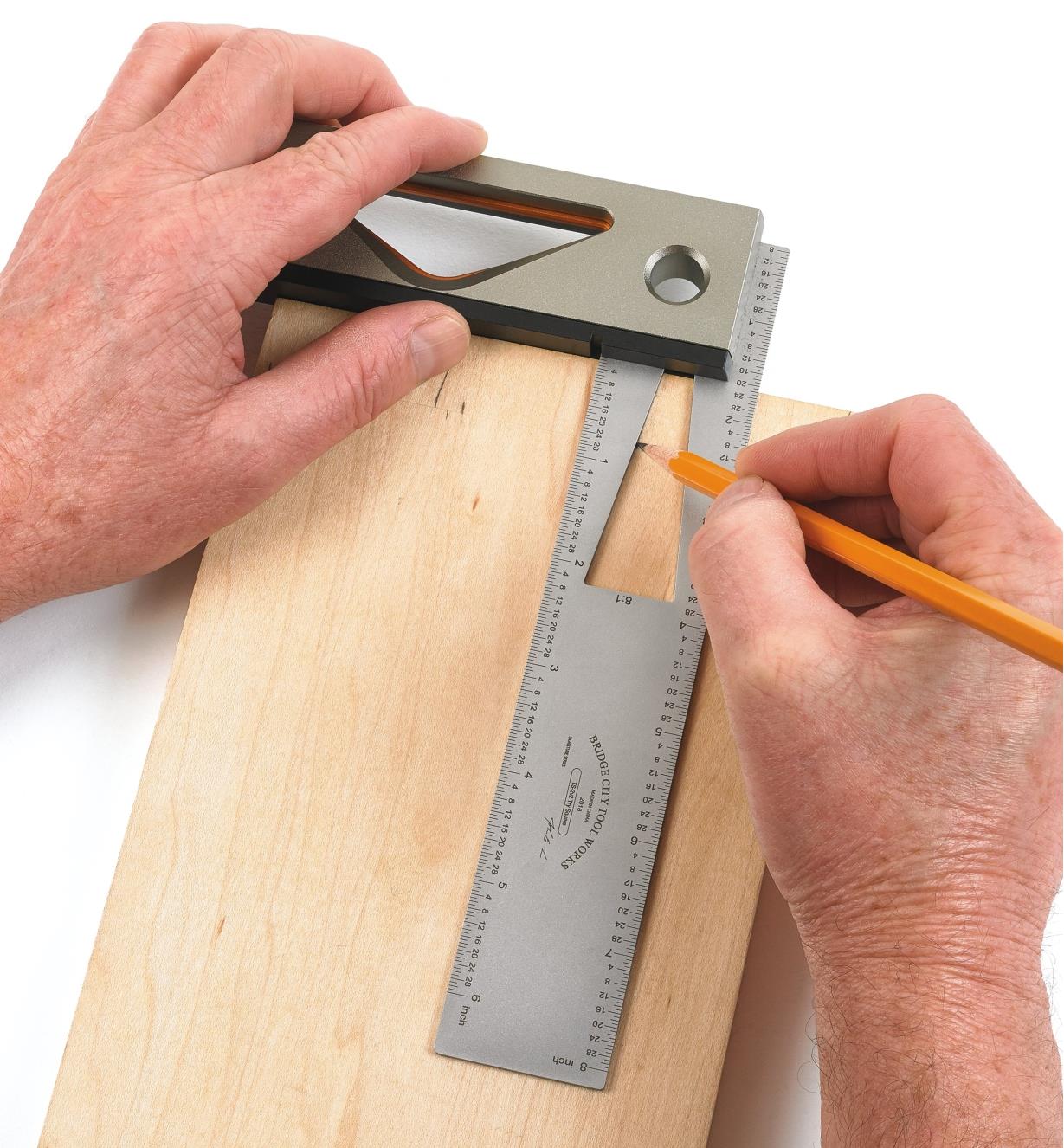 Using the cut-out in the blade of the try square to mark out dovetail angles