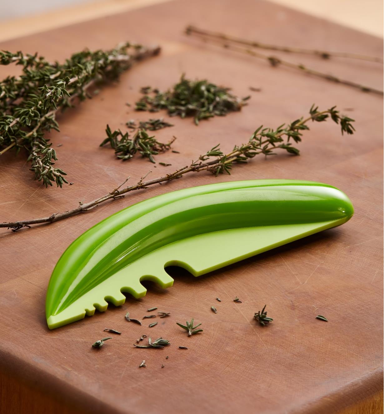 Herb Stripper with sprigs of fresh thyme