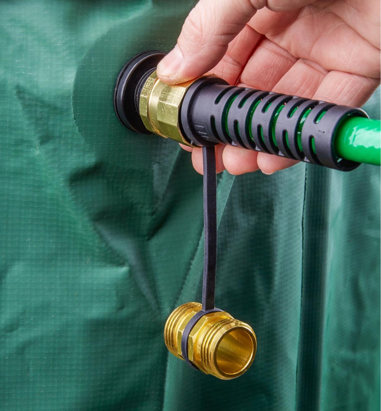 Attaching the universal leader hose to a rain barrel