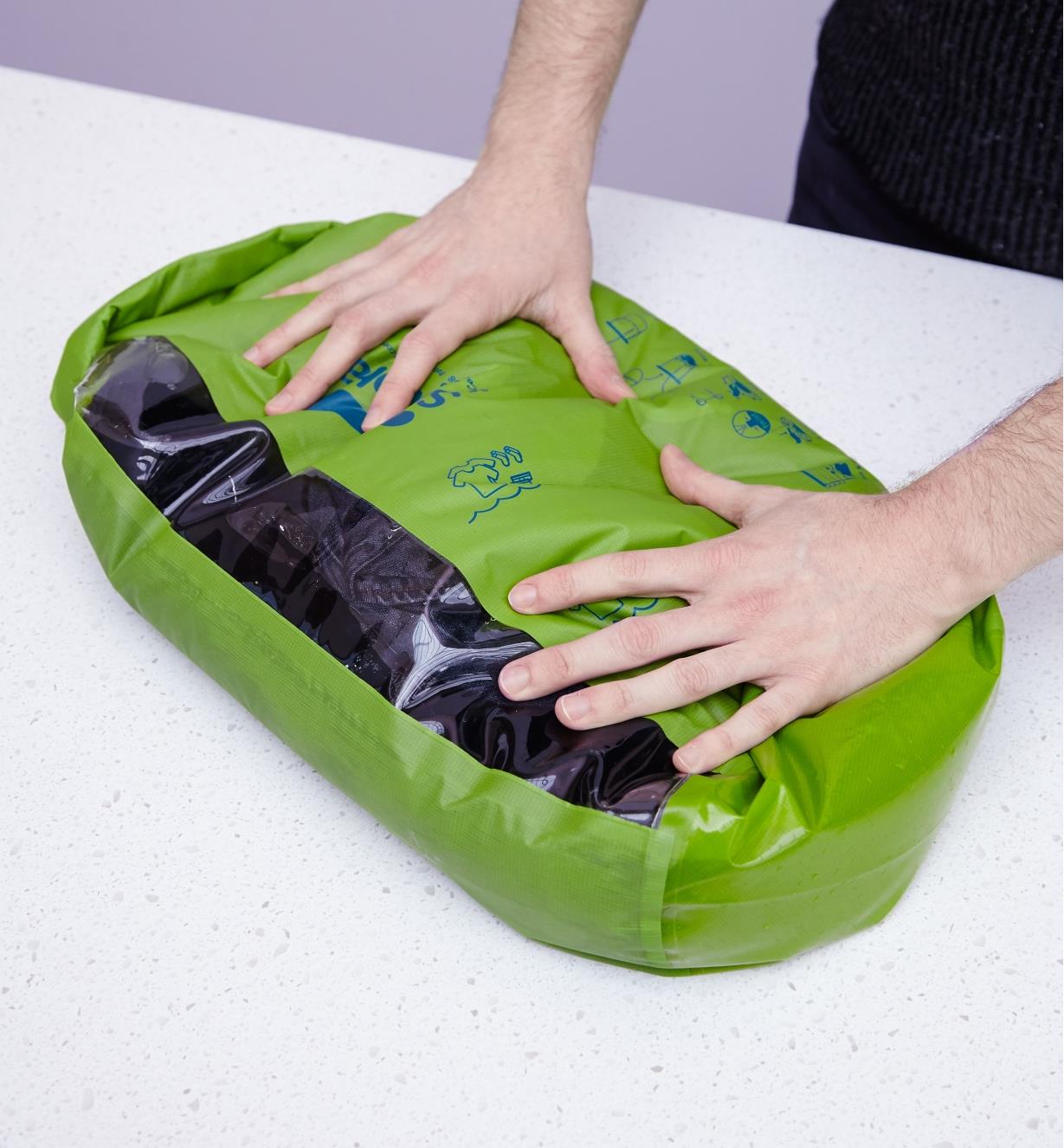 Rubbing the contents of the wash bag against the internal silicone washboard