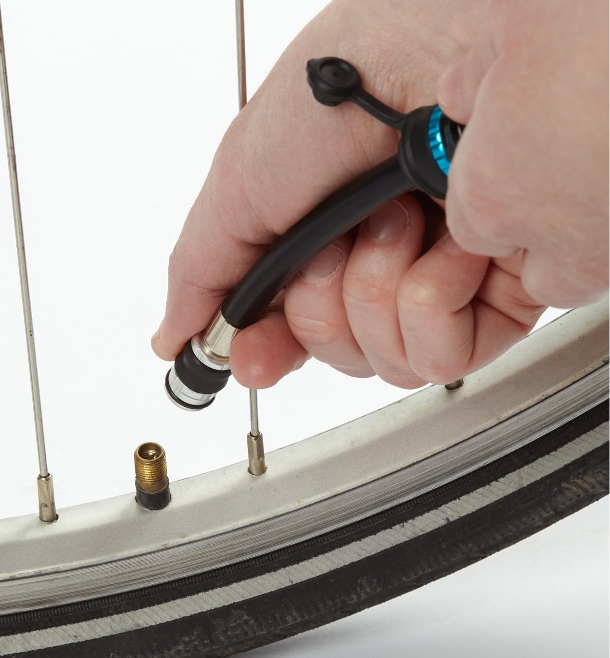 Attaching the hose fitting to a bicycle tire valve