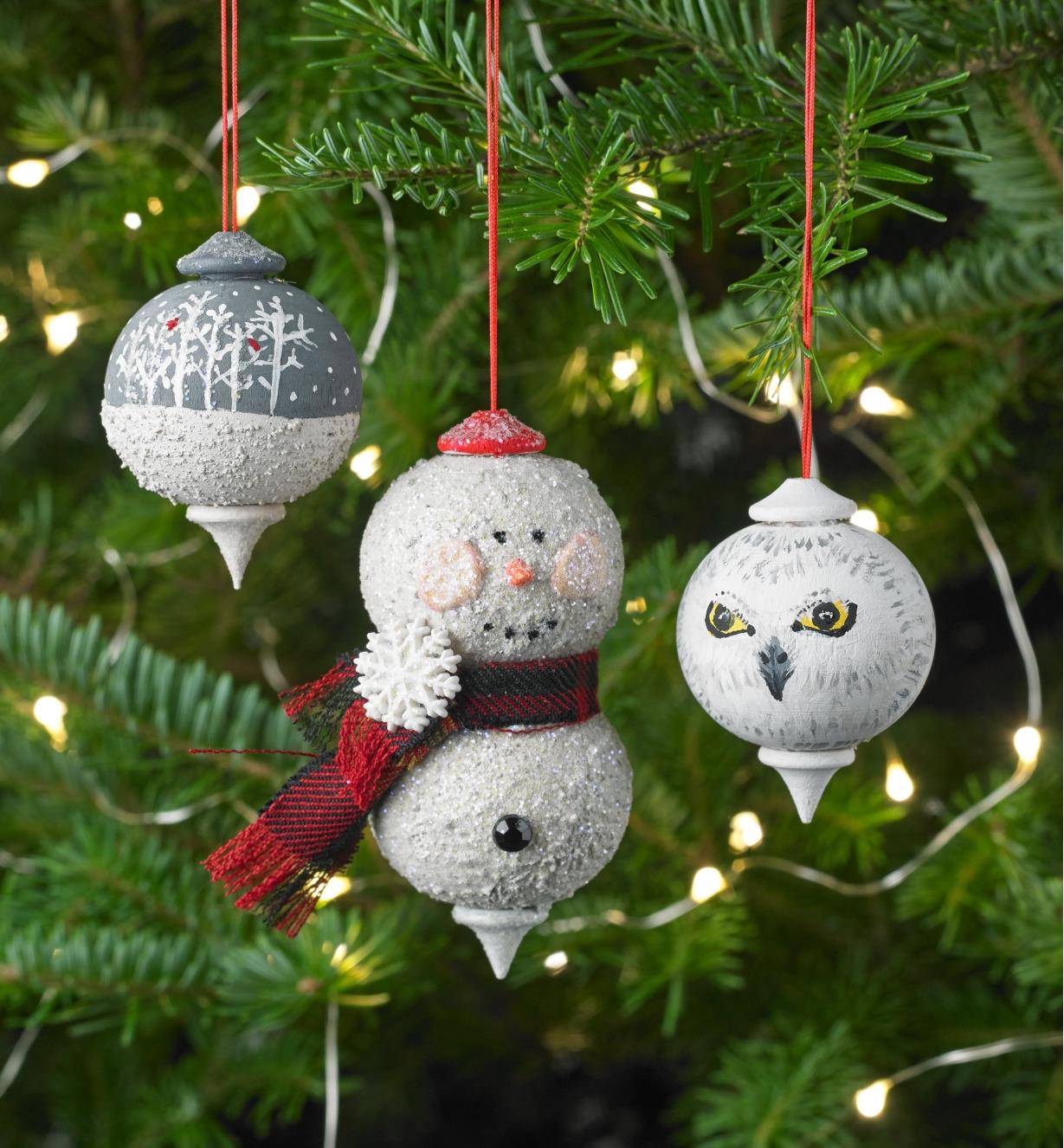Decorated wooden ornaments hanging on a Christmas tree