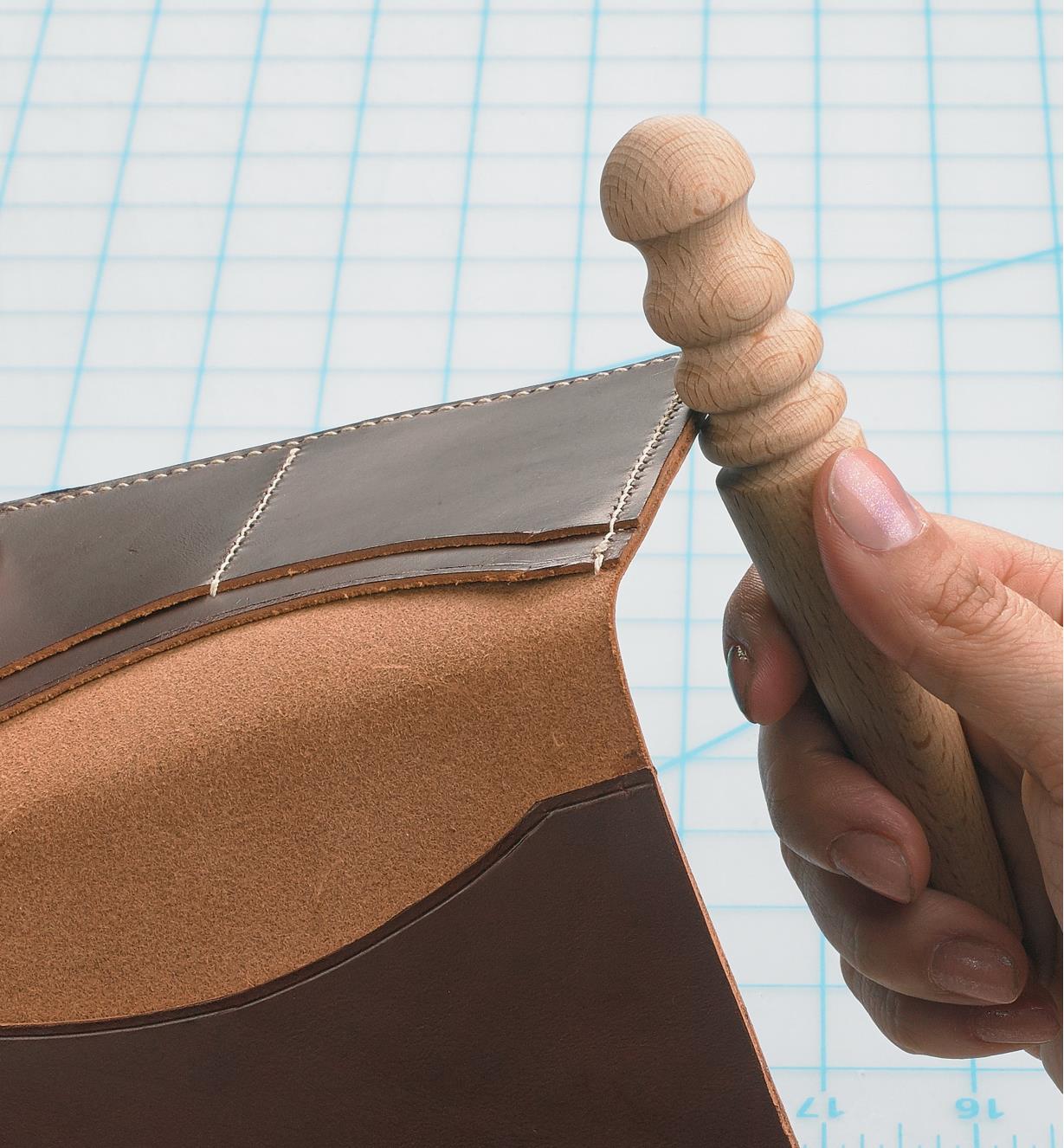 Sealing the edge of a leather folder with the Leather Slicker