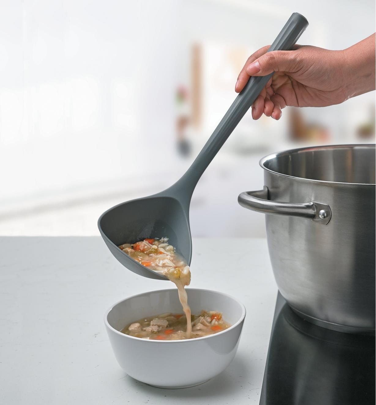 Using the Nylon Ladle to transfer soup from a pot into a bowl