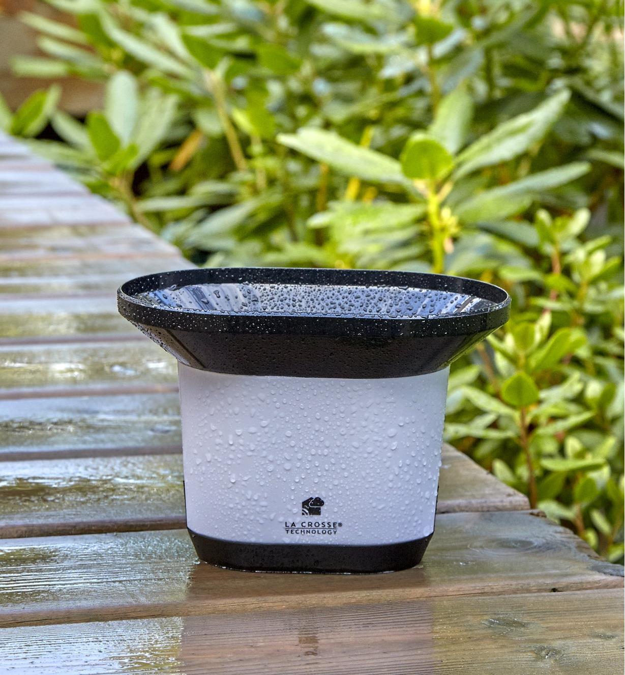 Rain sensor of the Wi-Fi weather station with wind and rain collects rainfall in its funnel