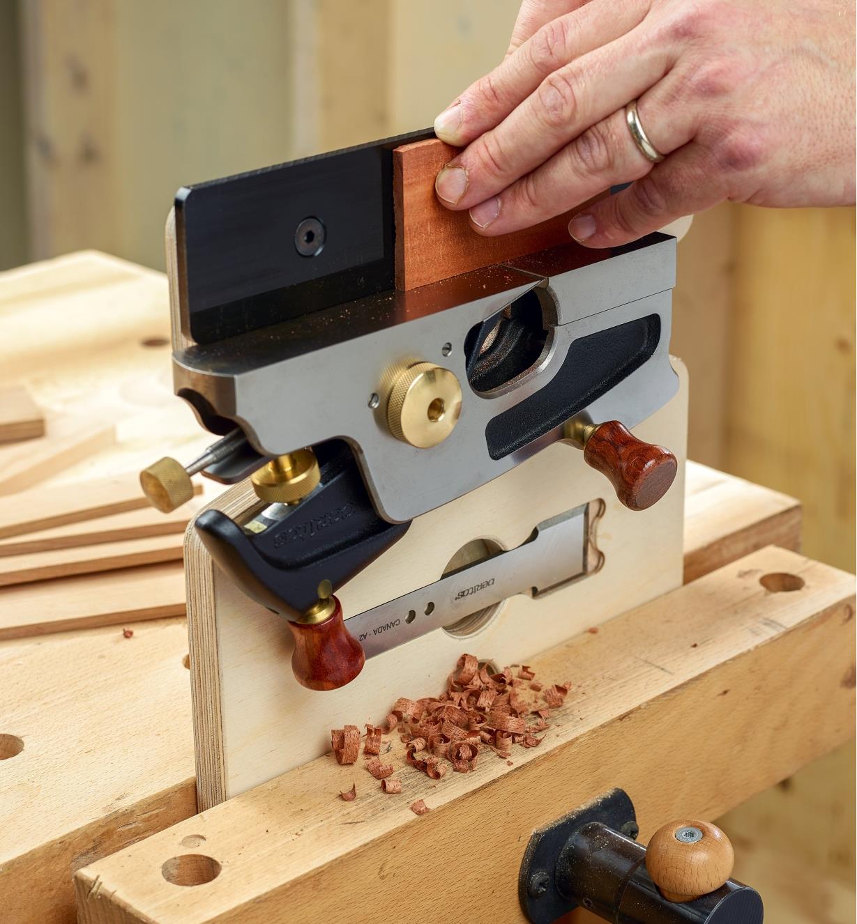 Planing a small part using a large shoulder plane in an upright hand jointer
