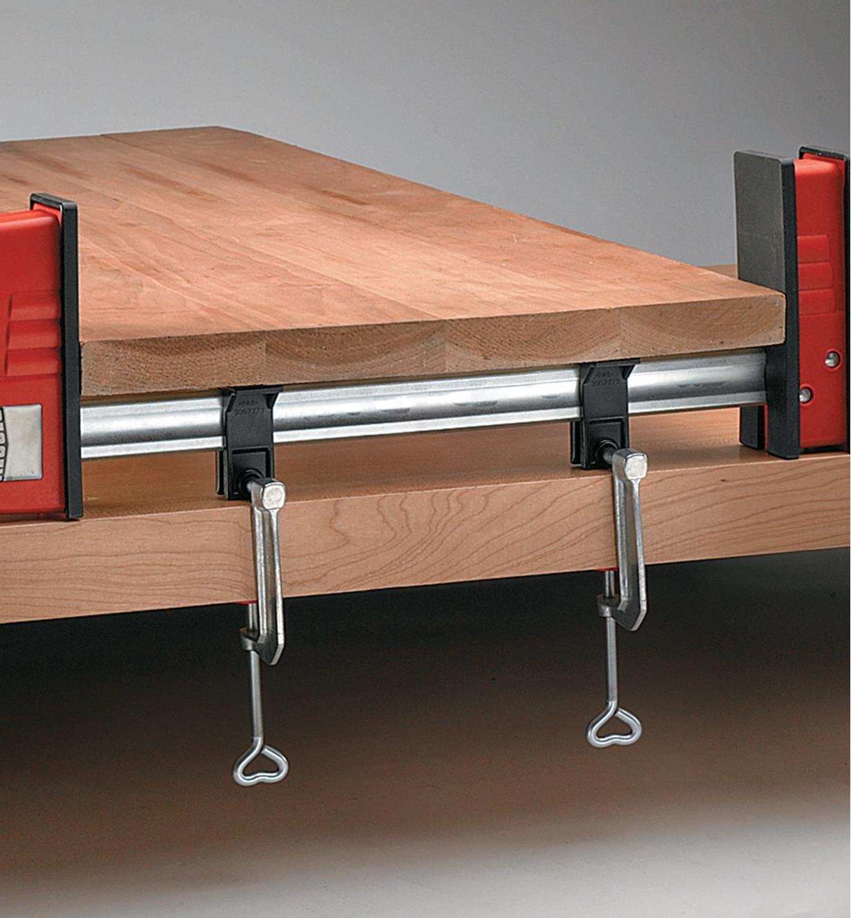 Table clamps used to secure a Bessey clamp to a worktable