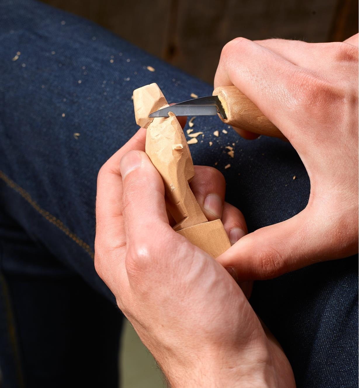 Carving a wooden statuette with a Flexcut cutting knife