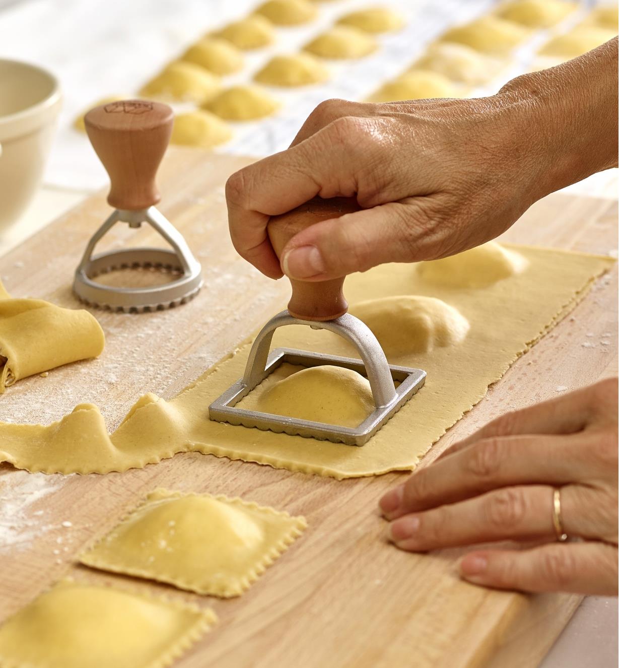 Cutting out ravioli shapes in the kitchen