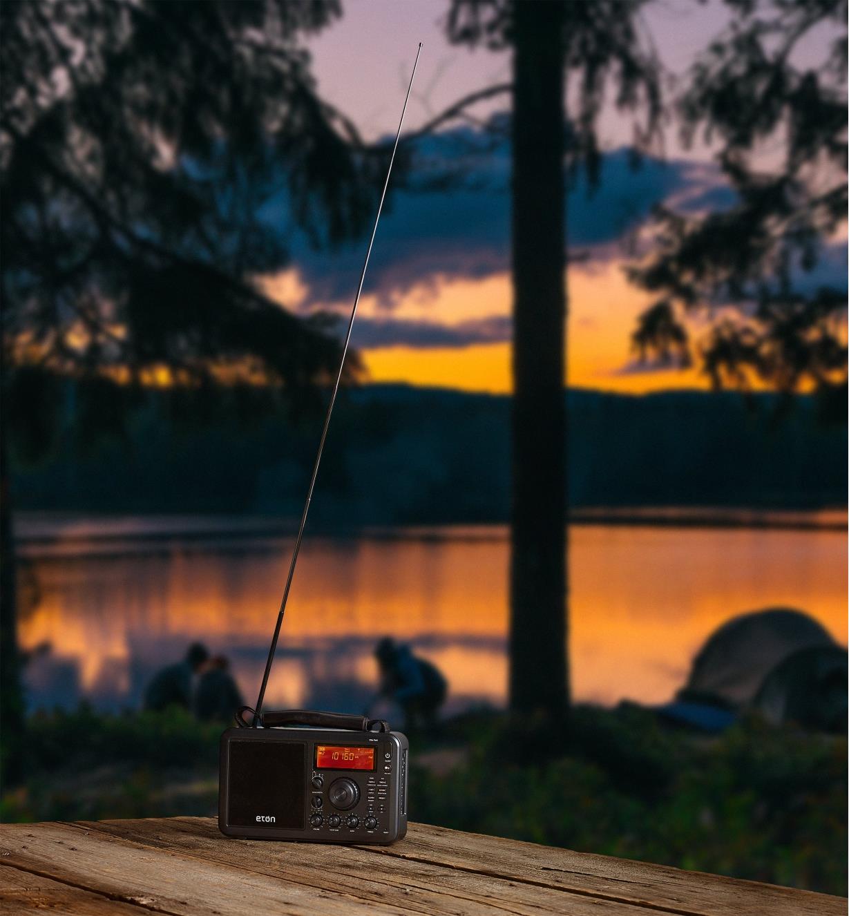 Eton AM/FM shortwave radio at a remote campsite with telescoping antenna extended for better reception