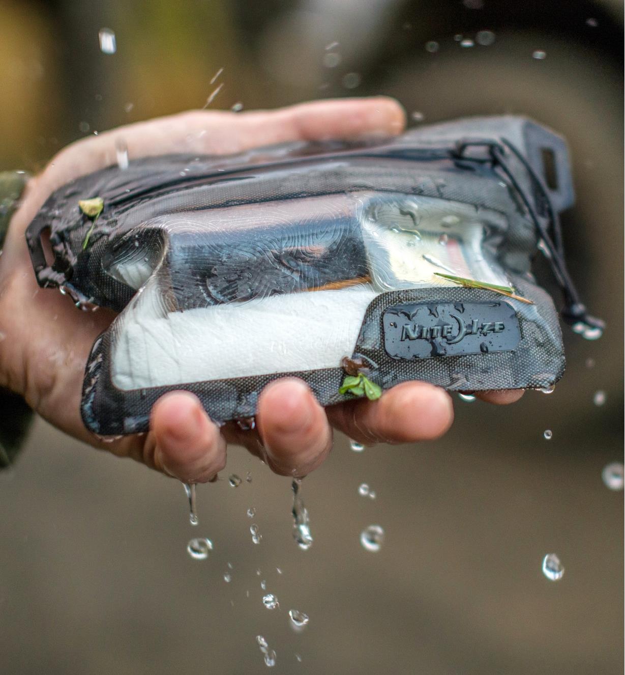 Shaking water off a Nite Ize RunOff Waterproof Wallet