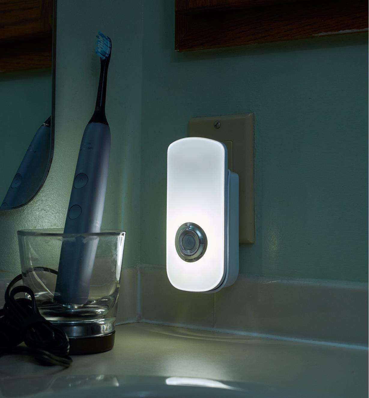 Rechargeable LED nightlight/flashlight plugged into a standard outlet