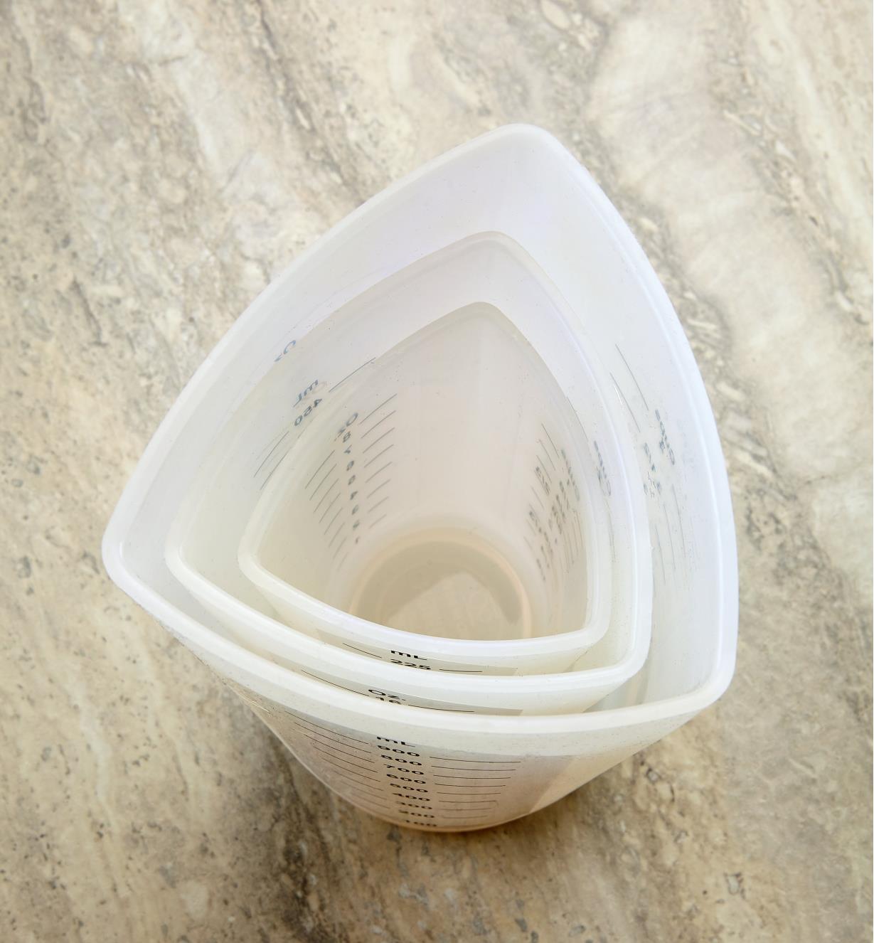Overhead view of three nested flexible silicone measuring cups