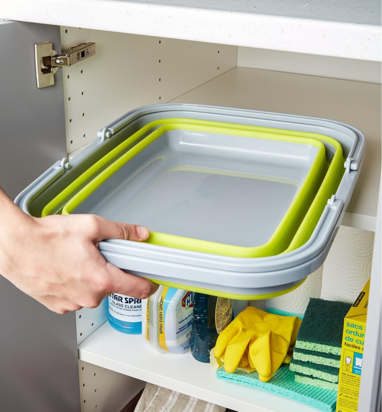 Collapsible tote collapses to fit into a cupboard