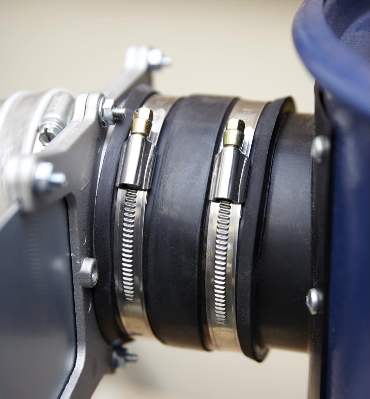 Close-up of the 4" I.D. flexible coupler showing the adjustable band clamps