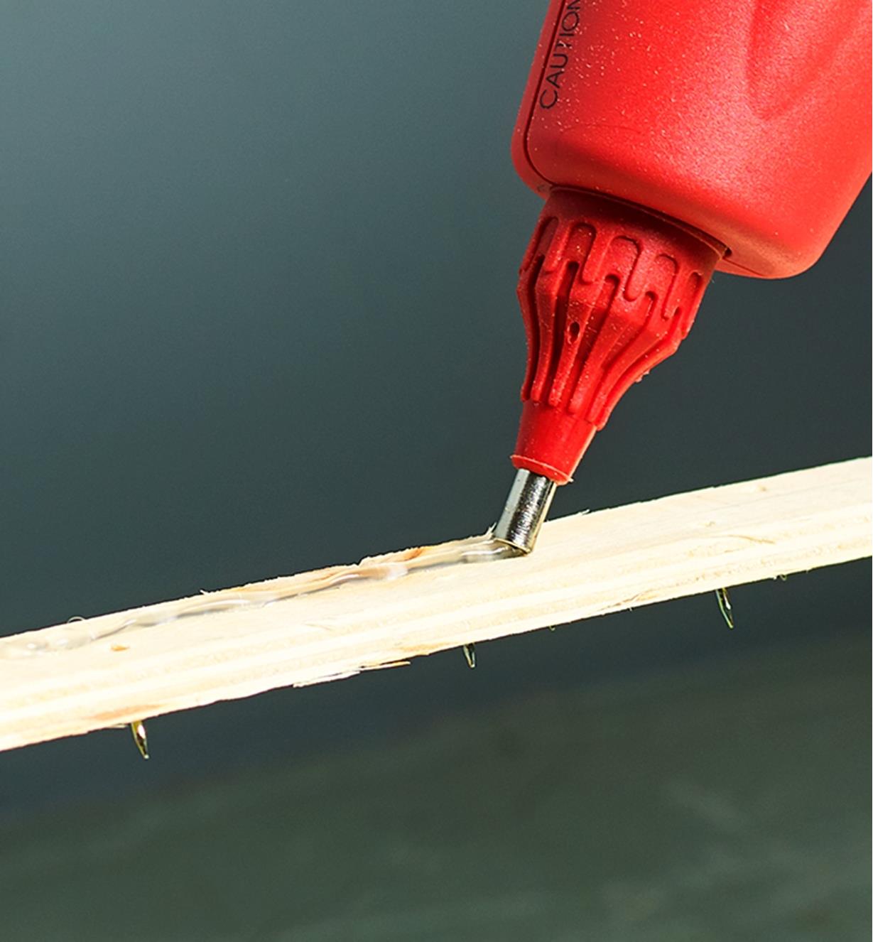 Applying a bead of glue using the regular nozzle supplied with the FastenMaster pro hot-melt gun