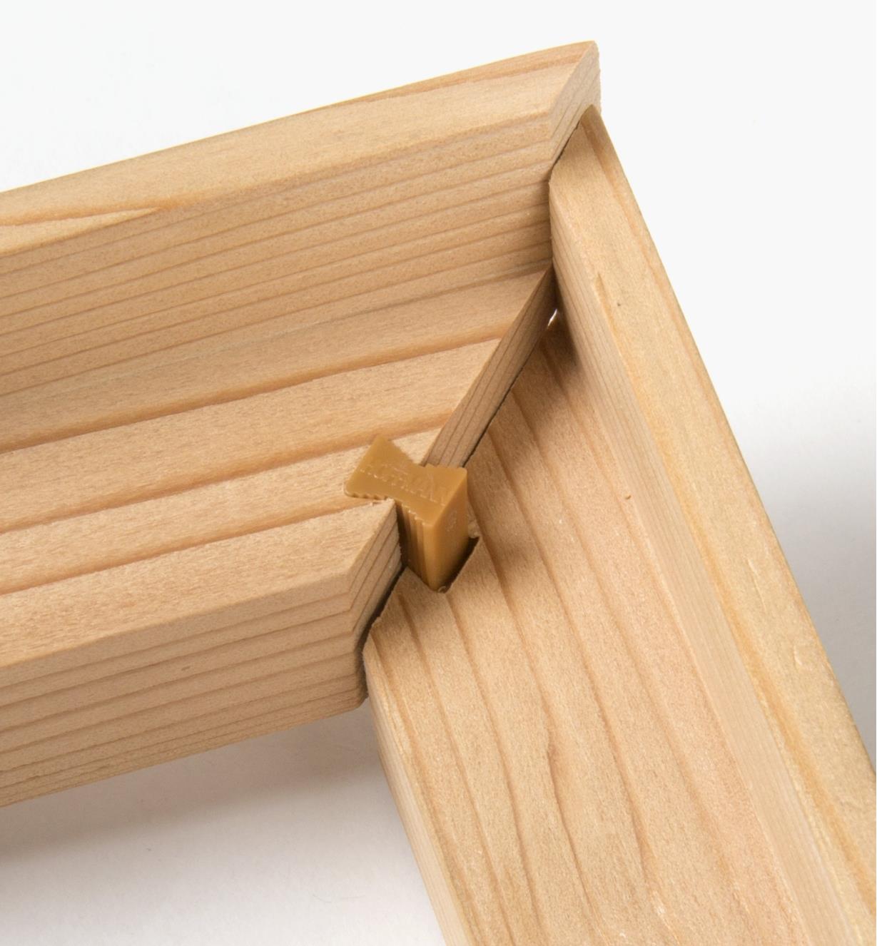 Close-up of two mitered skirt pieces being joined with a corner connector