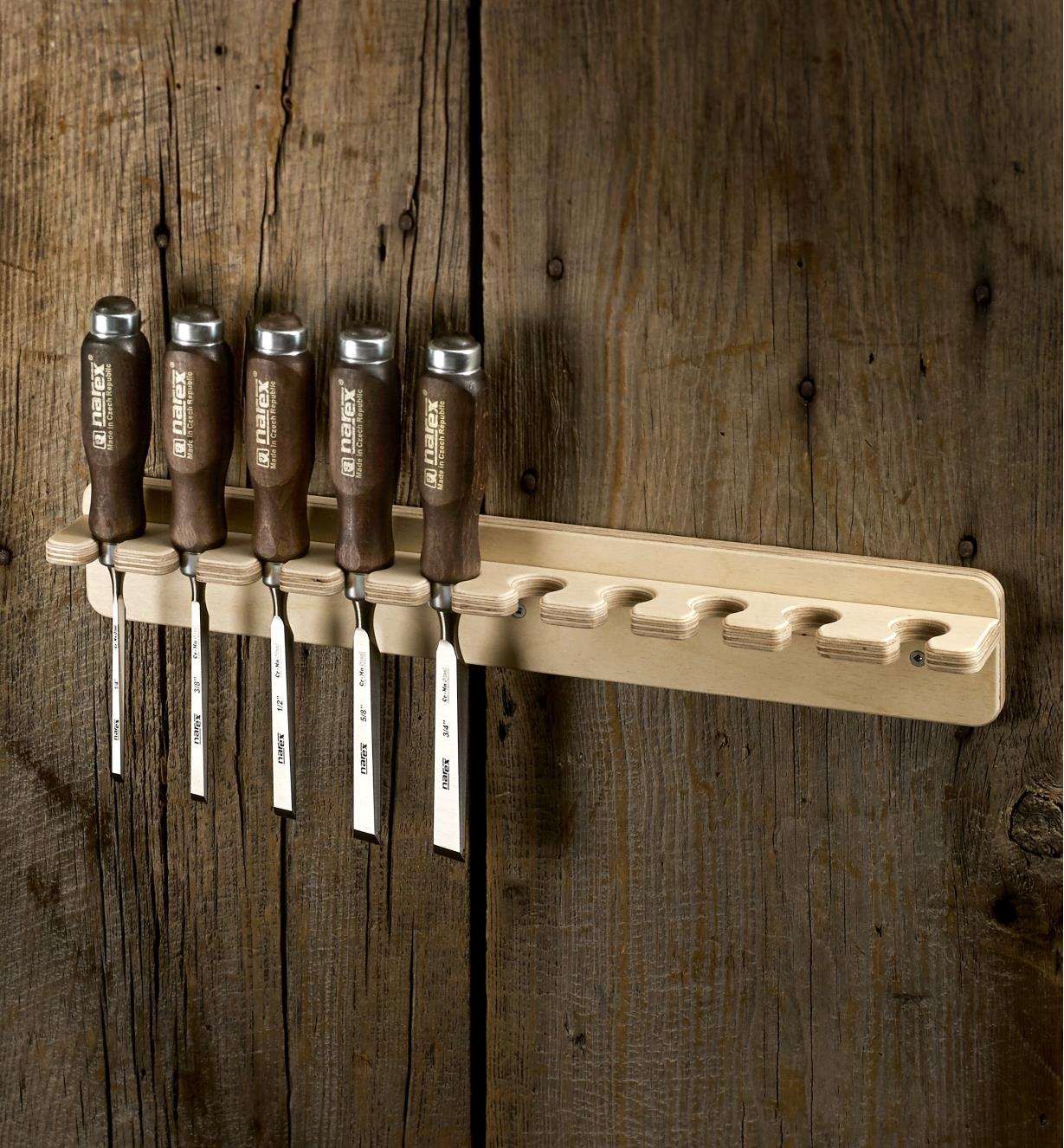 A wall rack for Narex bevel-edge chisels holding five chisels