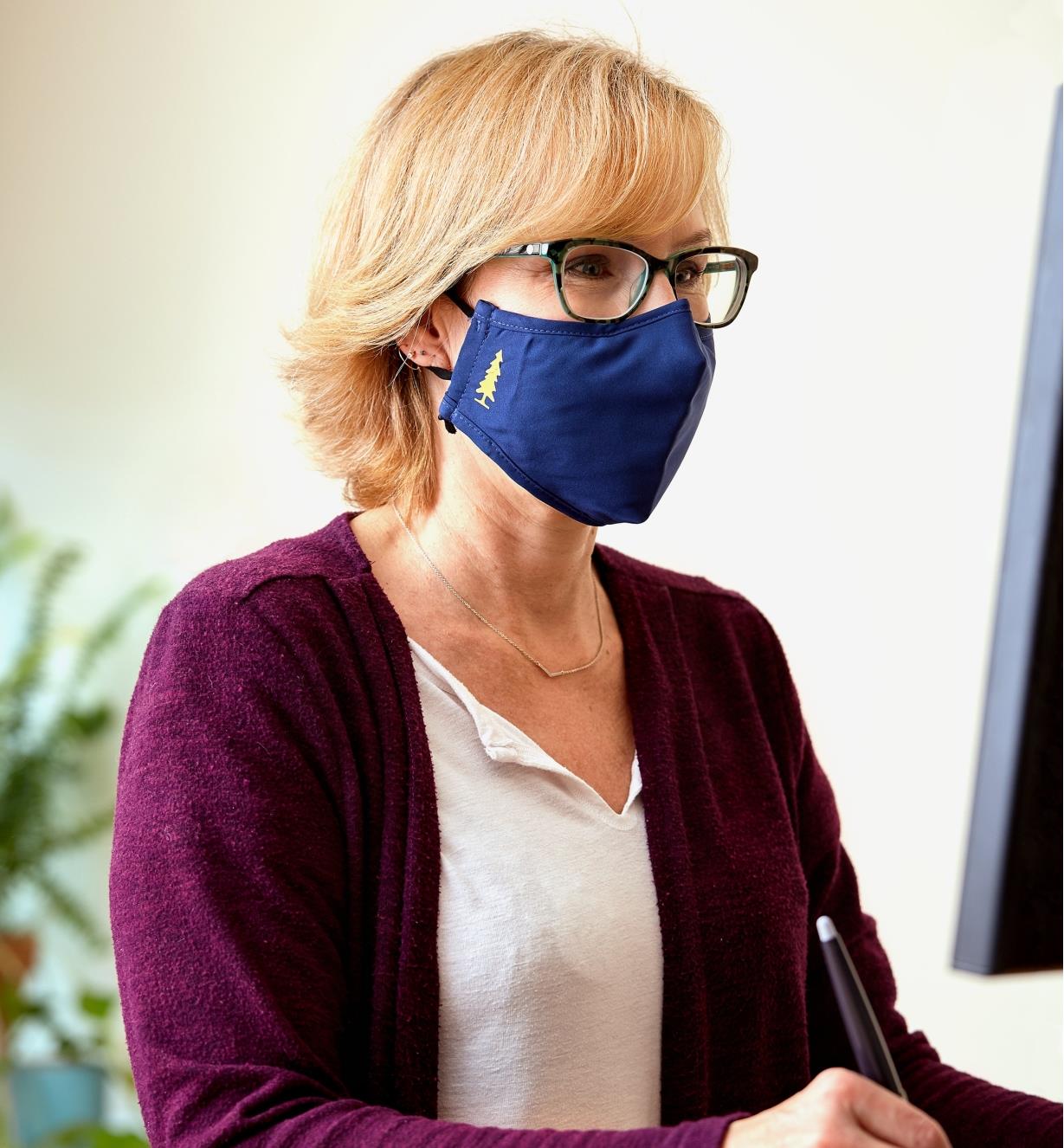 A woman wearing a Lee Valley face mask and eyeglasses