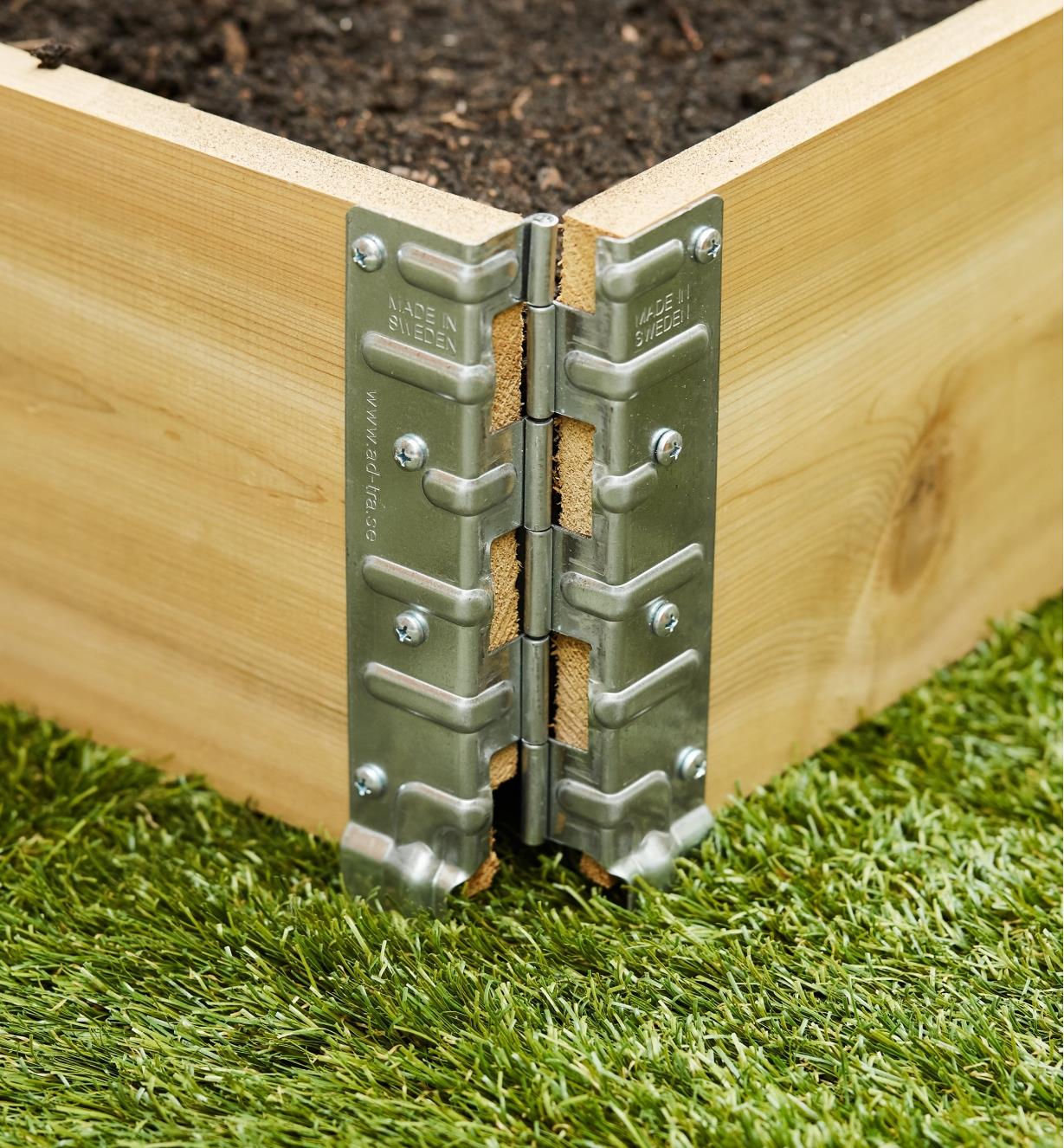 Close-up of corner of grow box made with stacking corners and lumber