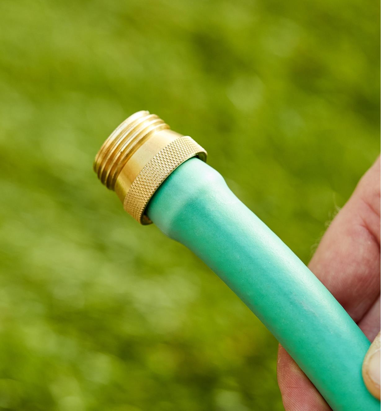 The male brass hose coupler installed on a hose end