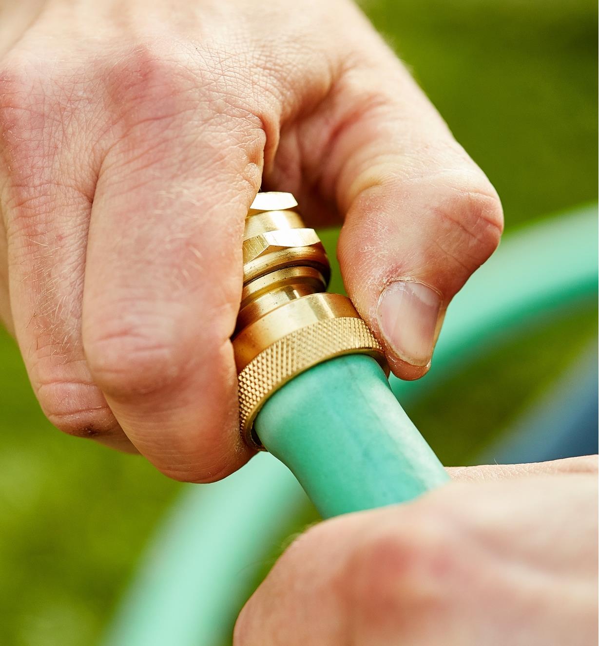 Hand tightening the female brass hose coupler ring