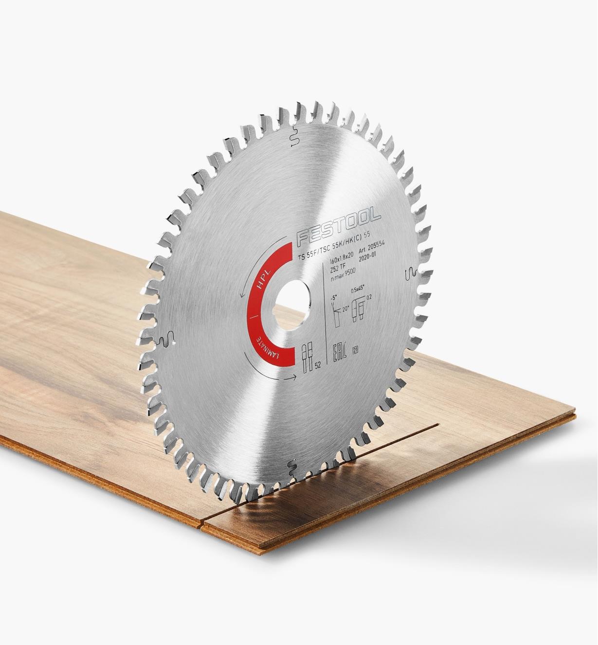 A laminate/HPL blade standing upright on a piece of laminate flooring
