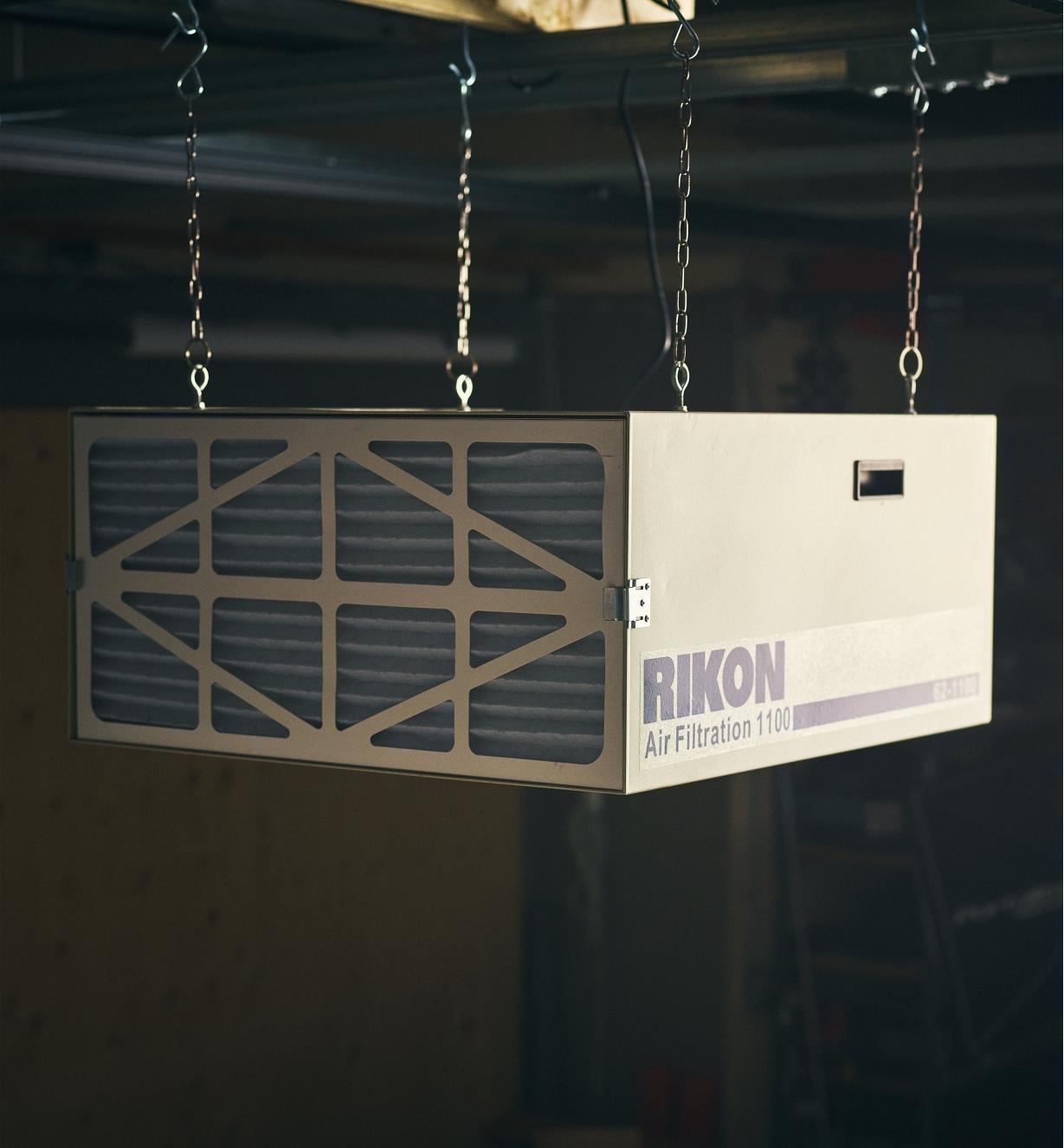 Rikon 1100 CFM air cleaner suspended from a ceiling