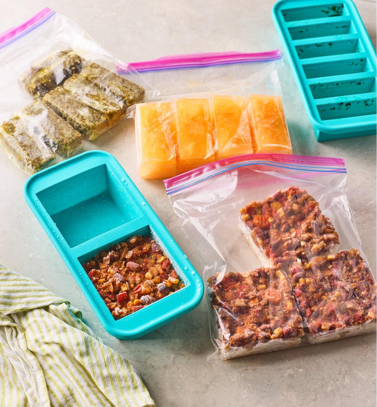 Two Souper Cube trays and freezer bags of frozen food