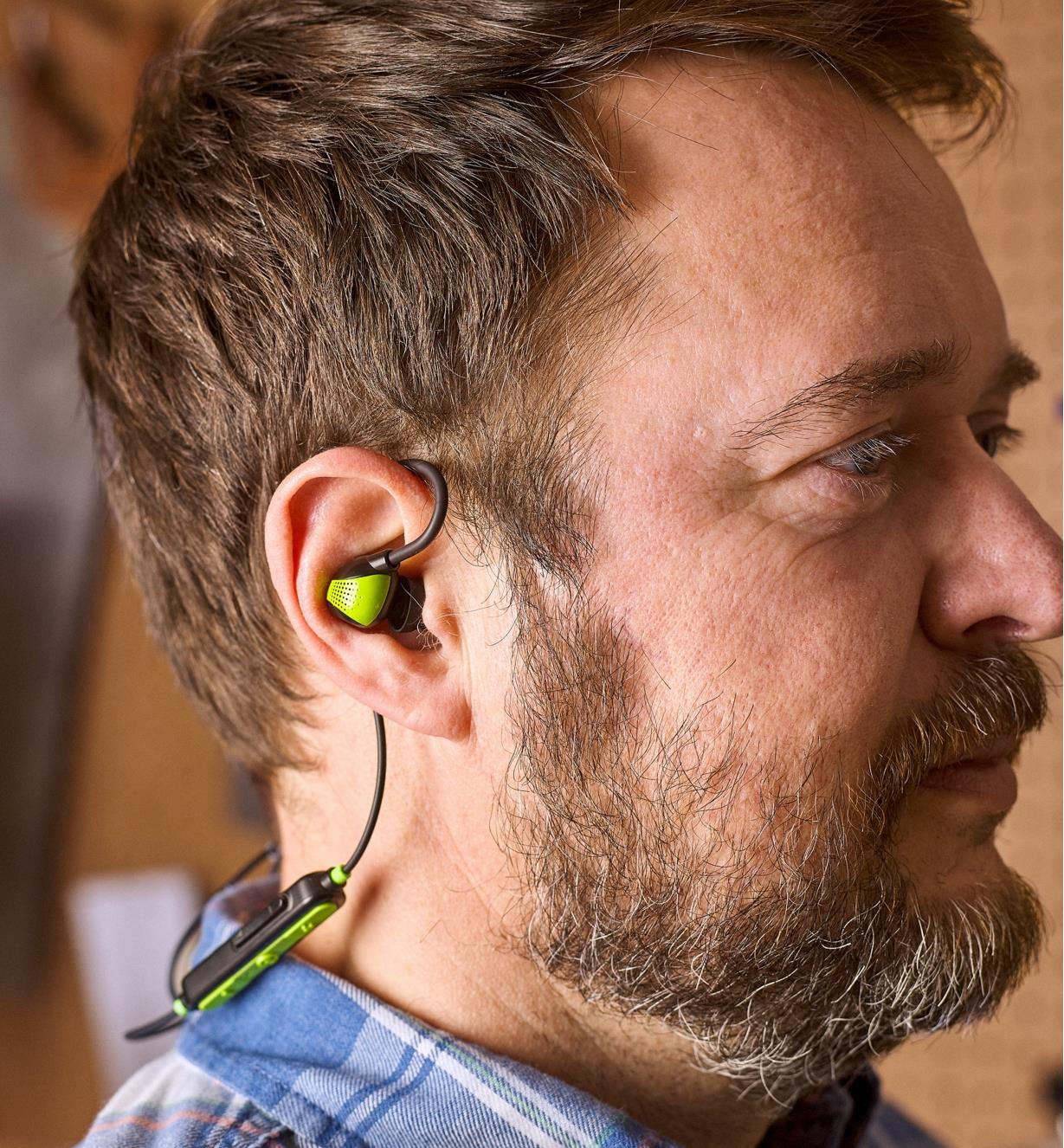 View of an ISOTunes PRO Aware hearing protector earbud worn in the ear