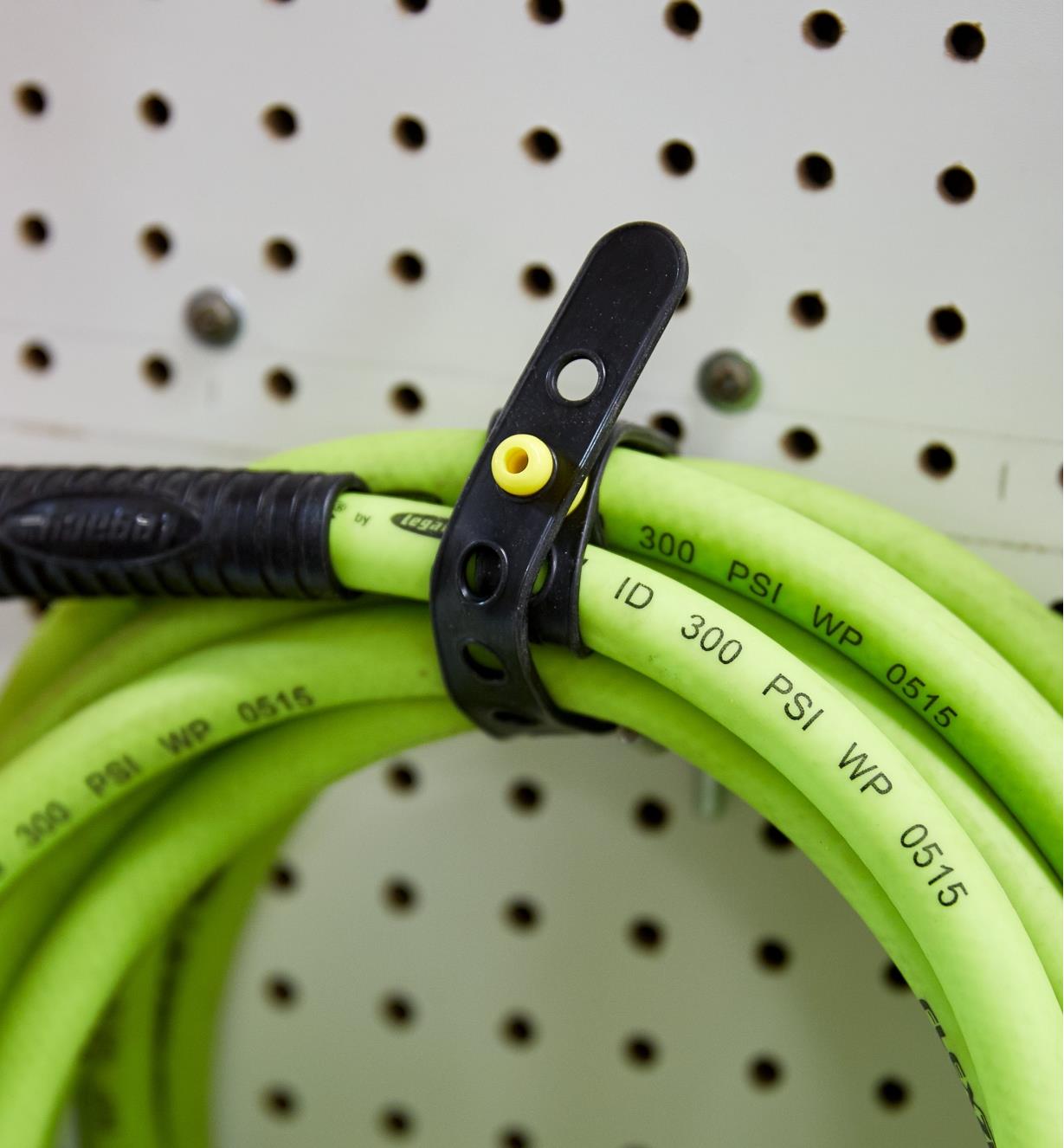 A coiled air hose secured with a Wrap-N-Strap