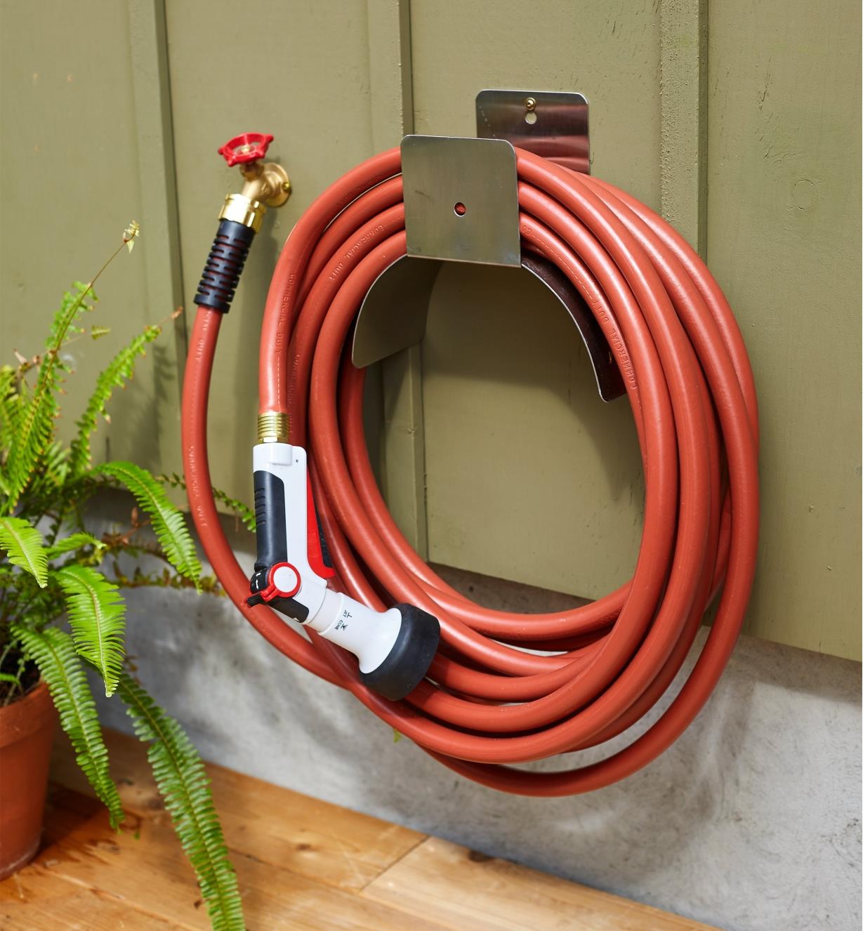 50' Hose attached to a faucet and wrapped around a hose hanger