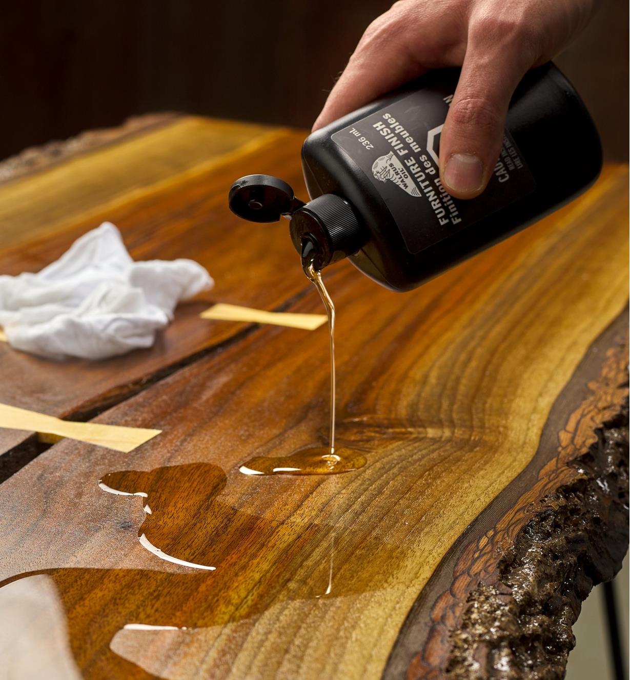 Applying a thin layer of Walrus Oil furniture finish to a table top
