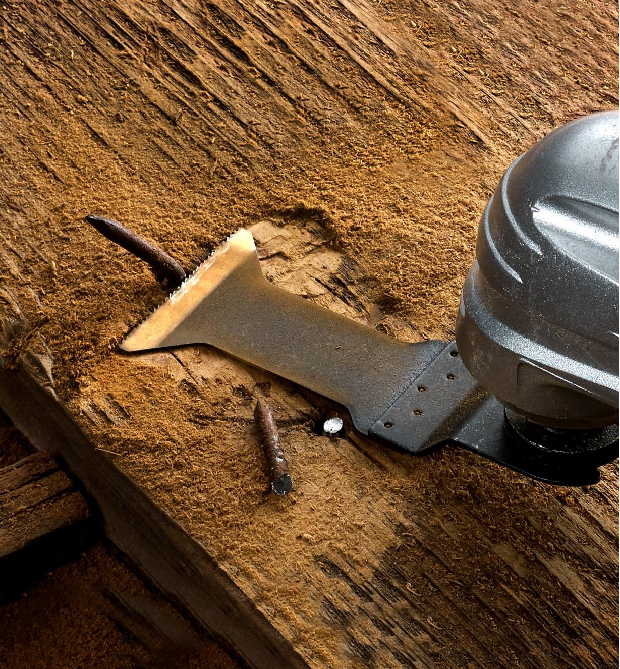 A multi-tool and titanium-nitride-coated blade used to cut nails in reclaimed barnboard