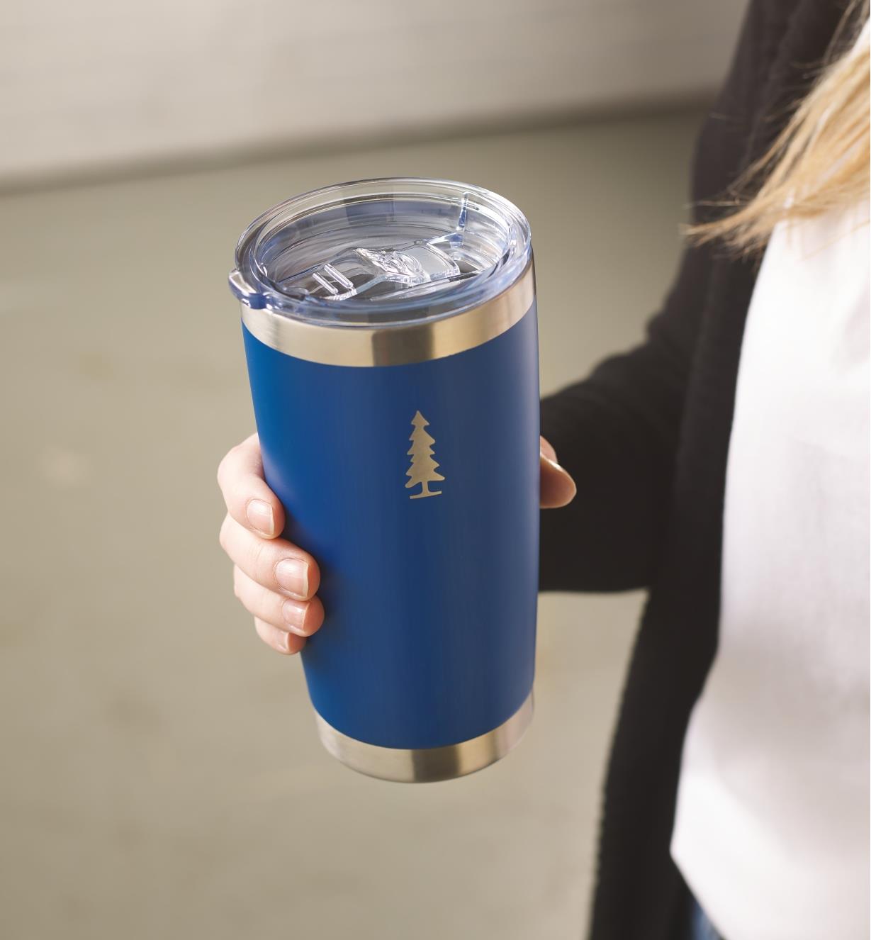 Holding a blue Lee Valley 20 oz insulated tumbler