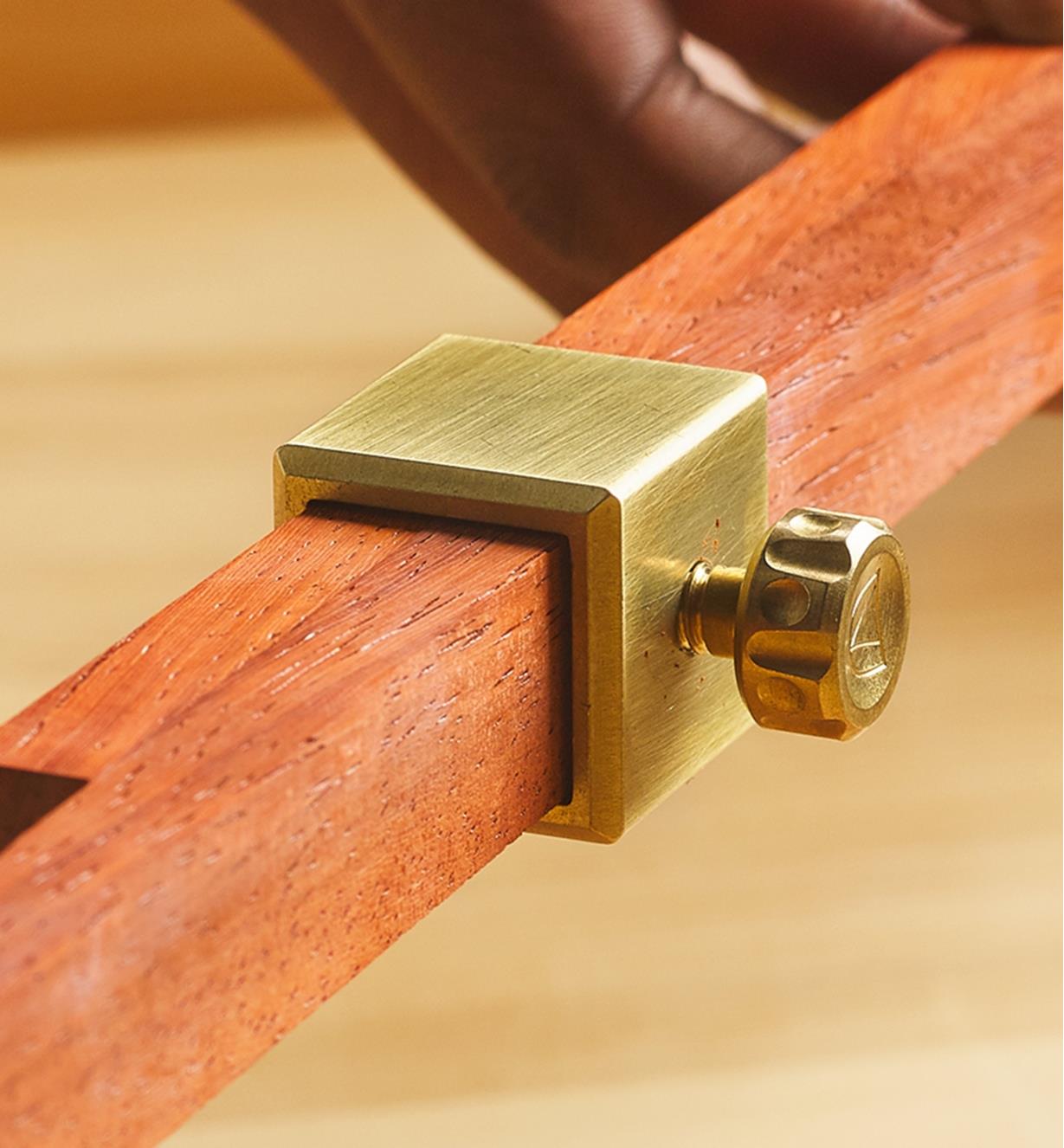 Brass hardware with a thumbscrew on Crucible pinch rods