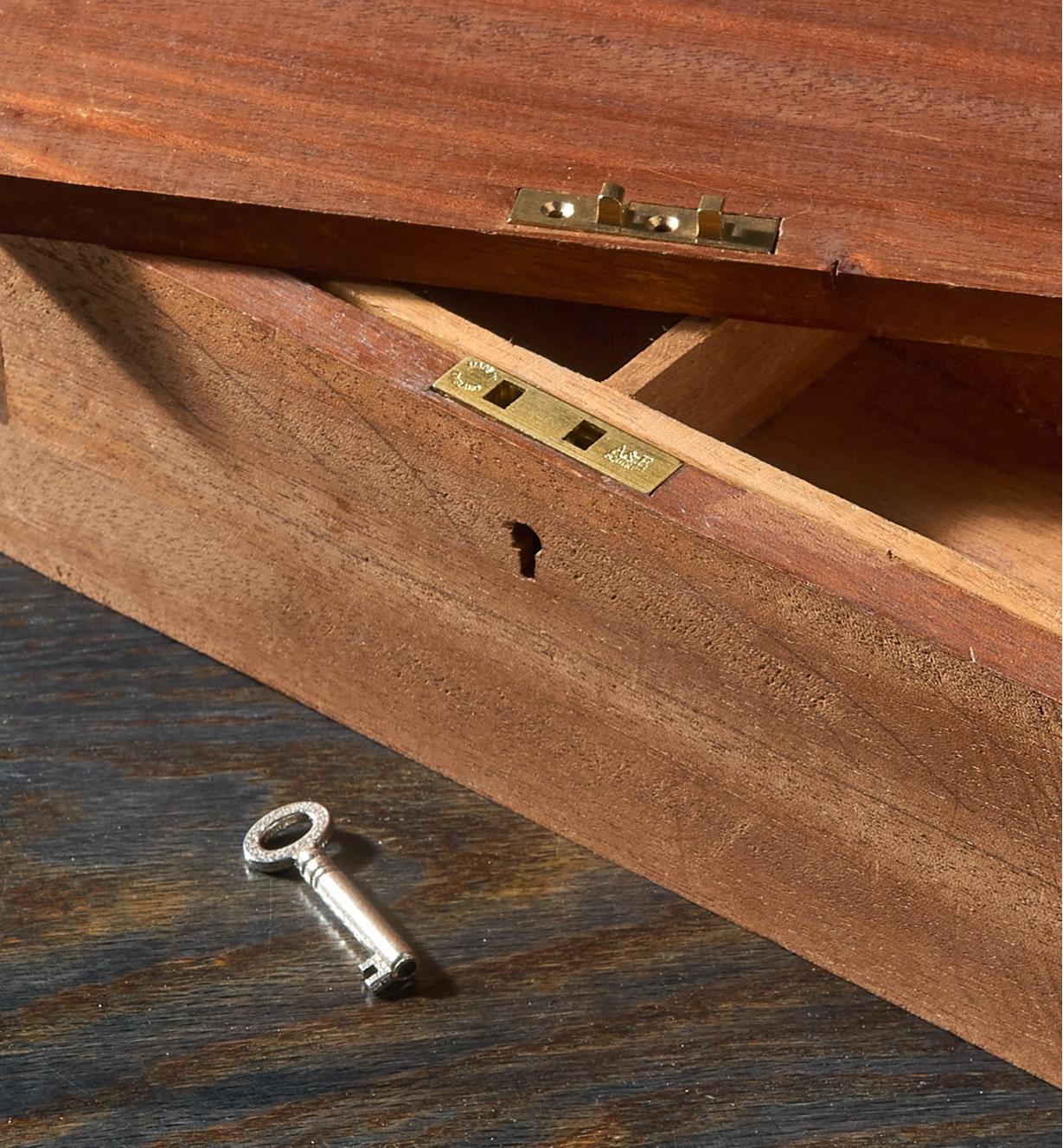 An economy box lock installed on a wooden box