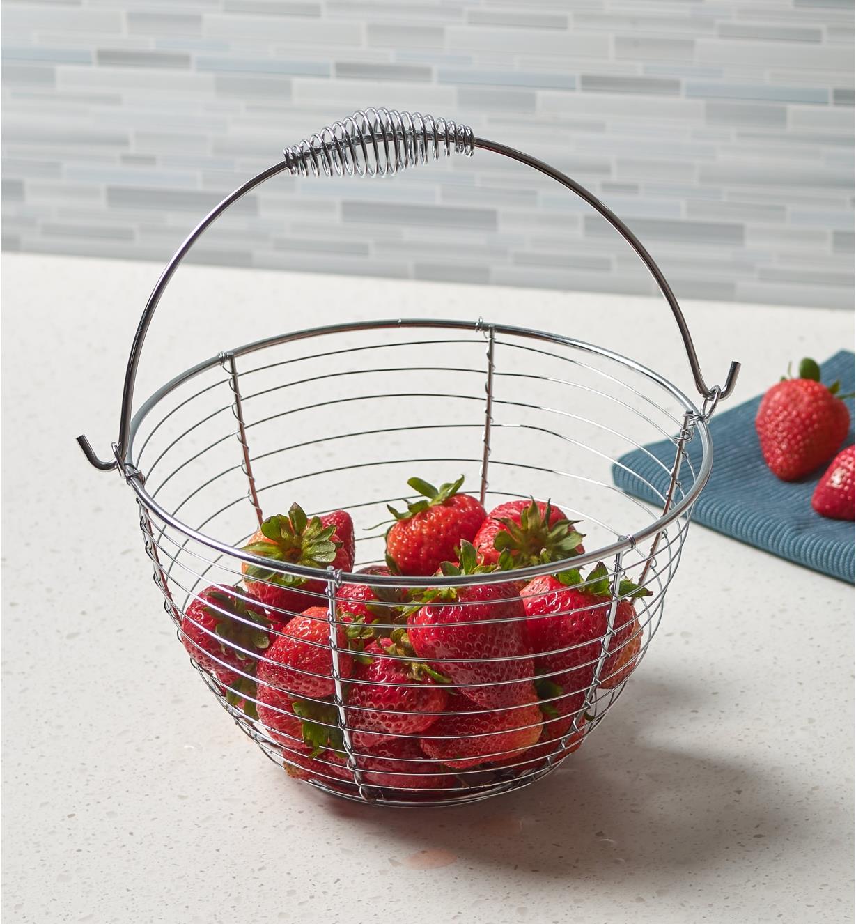 Small gardener’s wash basket containing strawberries 