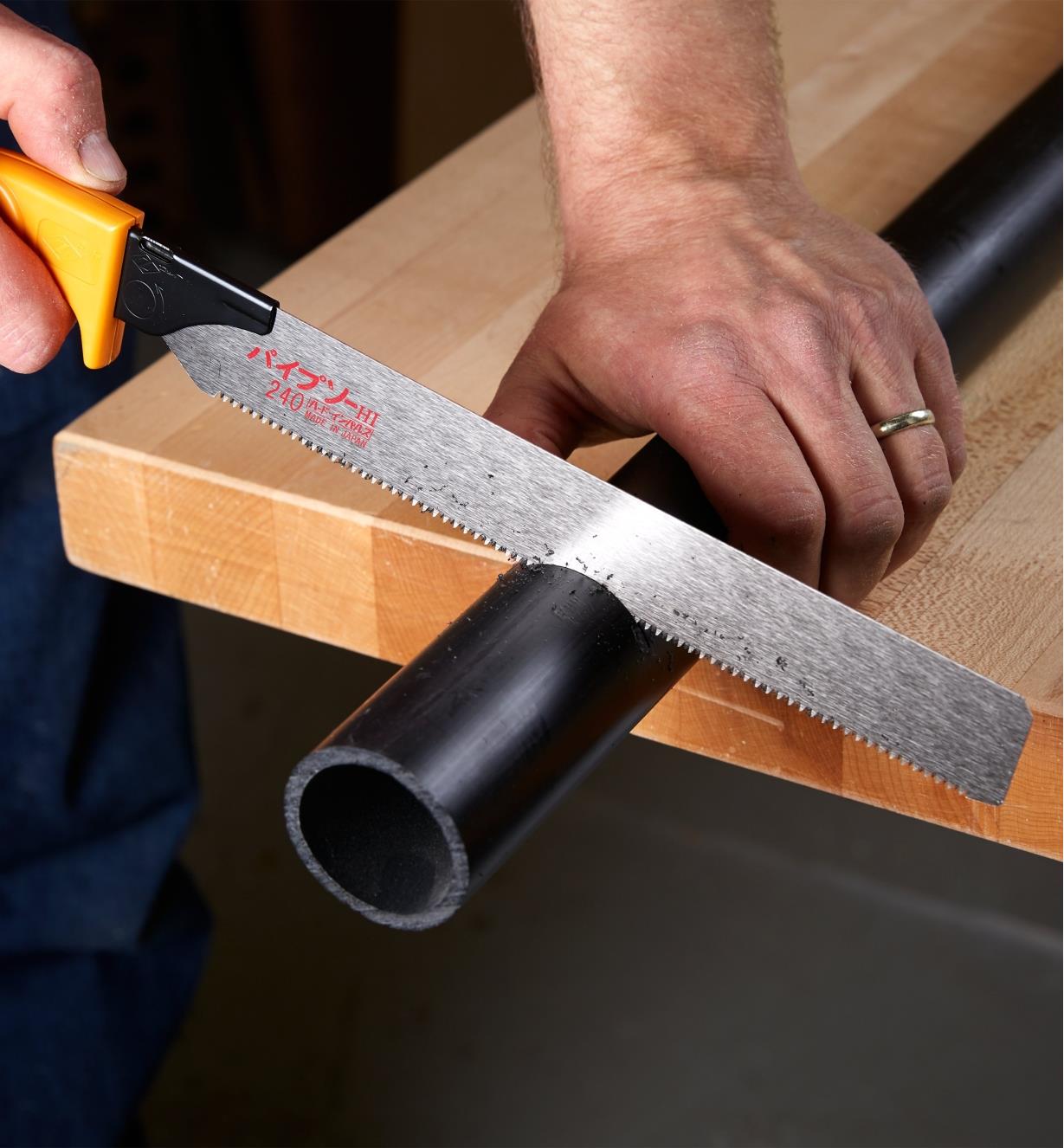 Cutting plastic pipe using a Japanese utility saw